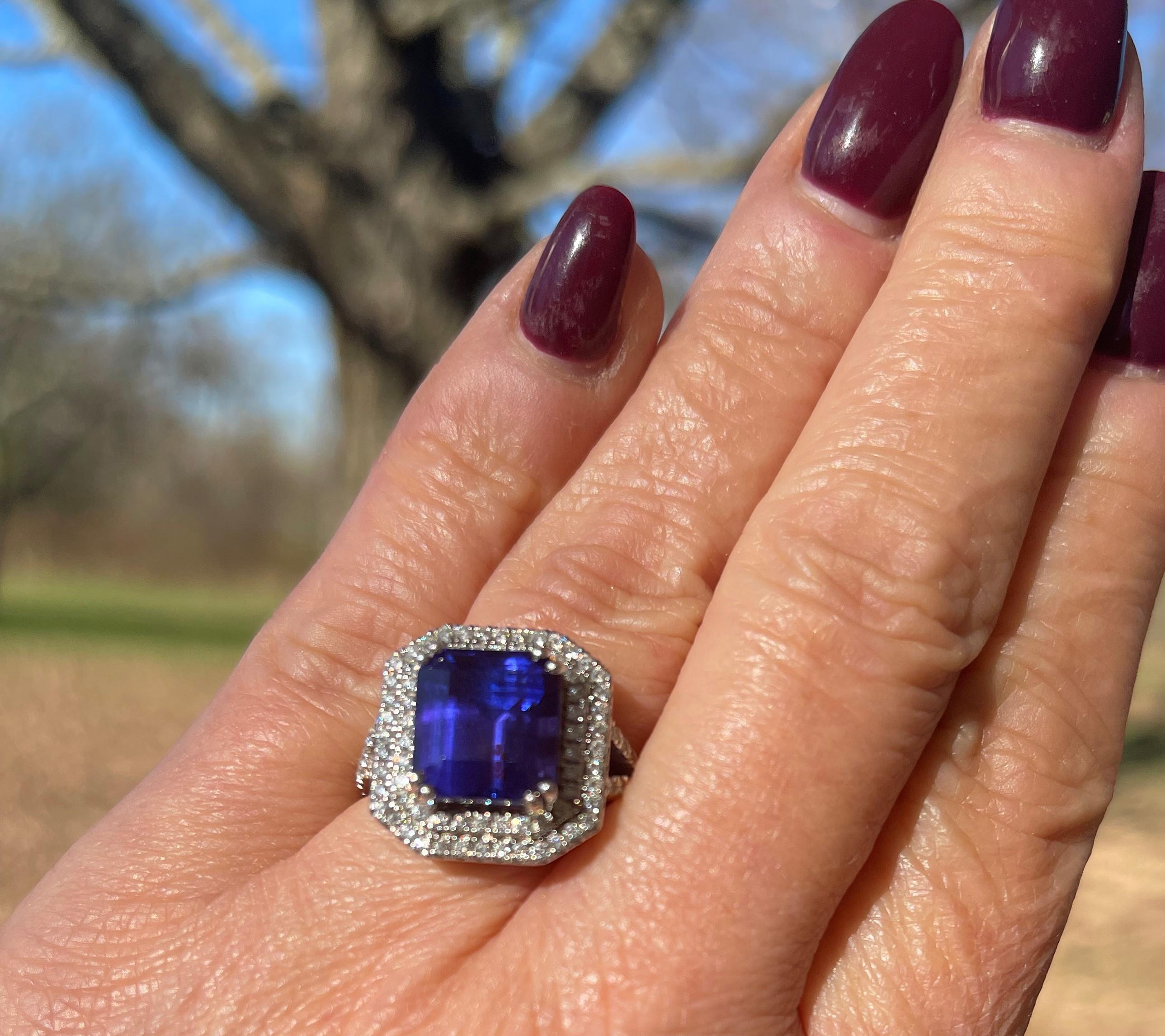 Fabulous deep blue and rich purple AAAA/Block D 7.56 ctw Tanzanite and 1.00 ctw diamond platinum cocktail ring.  Surrounded by sparkling E/F color and VS-VS1 diamonds creating a double halo.  December's birthstone that is a collector's item and will