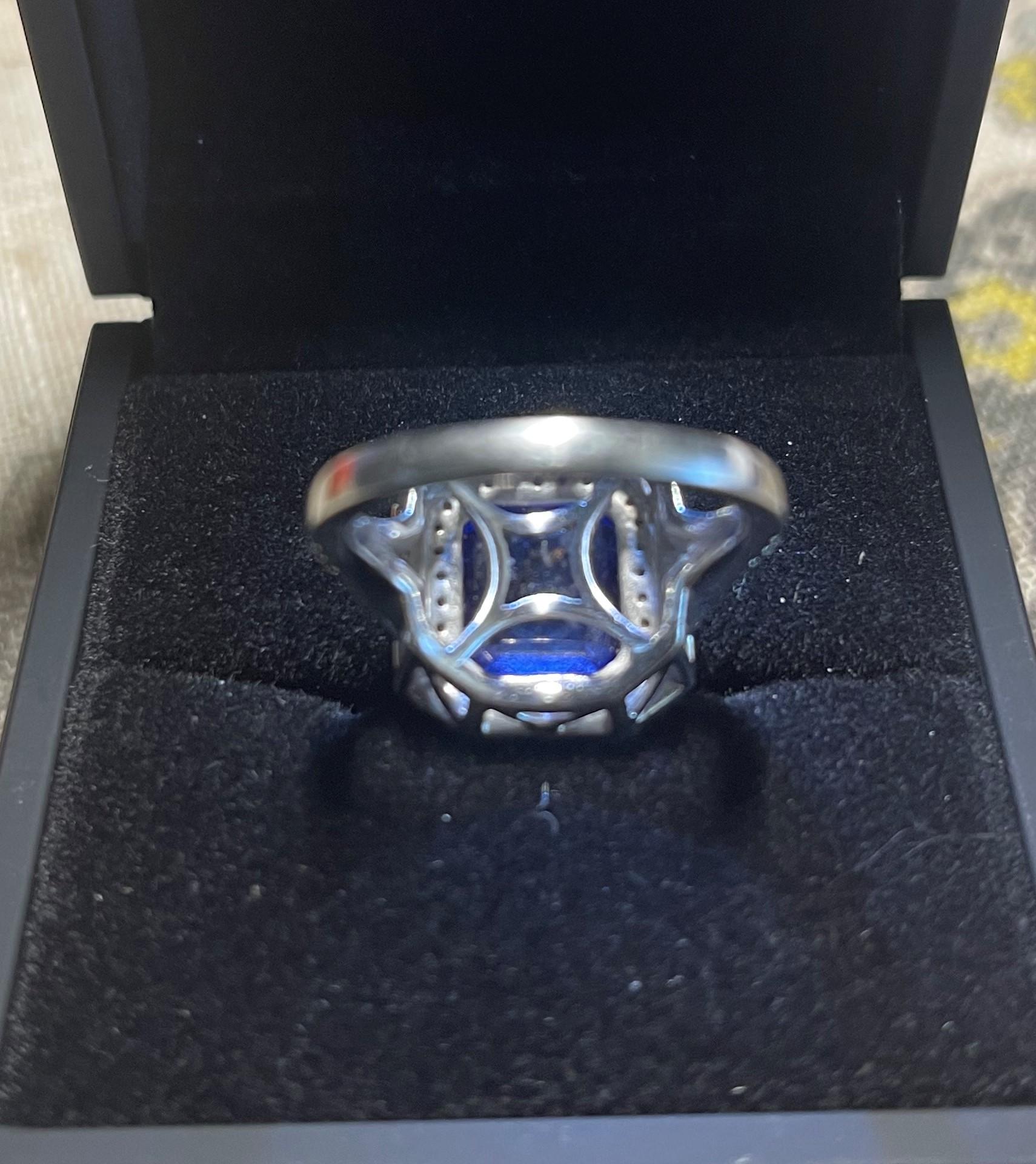 Contemporary 8.56 ctw AAAA/Block D Tanzanite and E-F/VS-VS1 Diamond Platinum Cocktail Ring For Sale