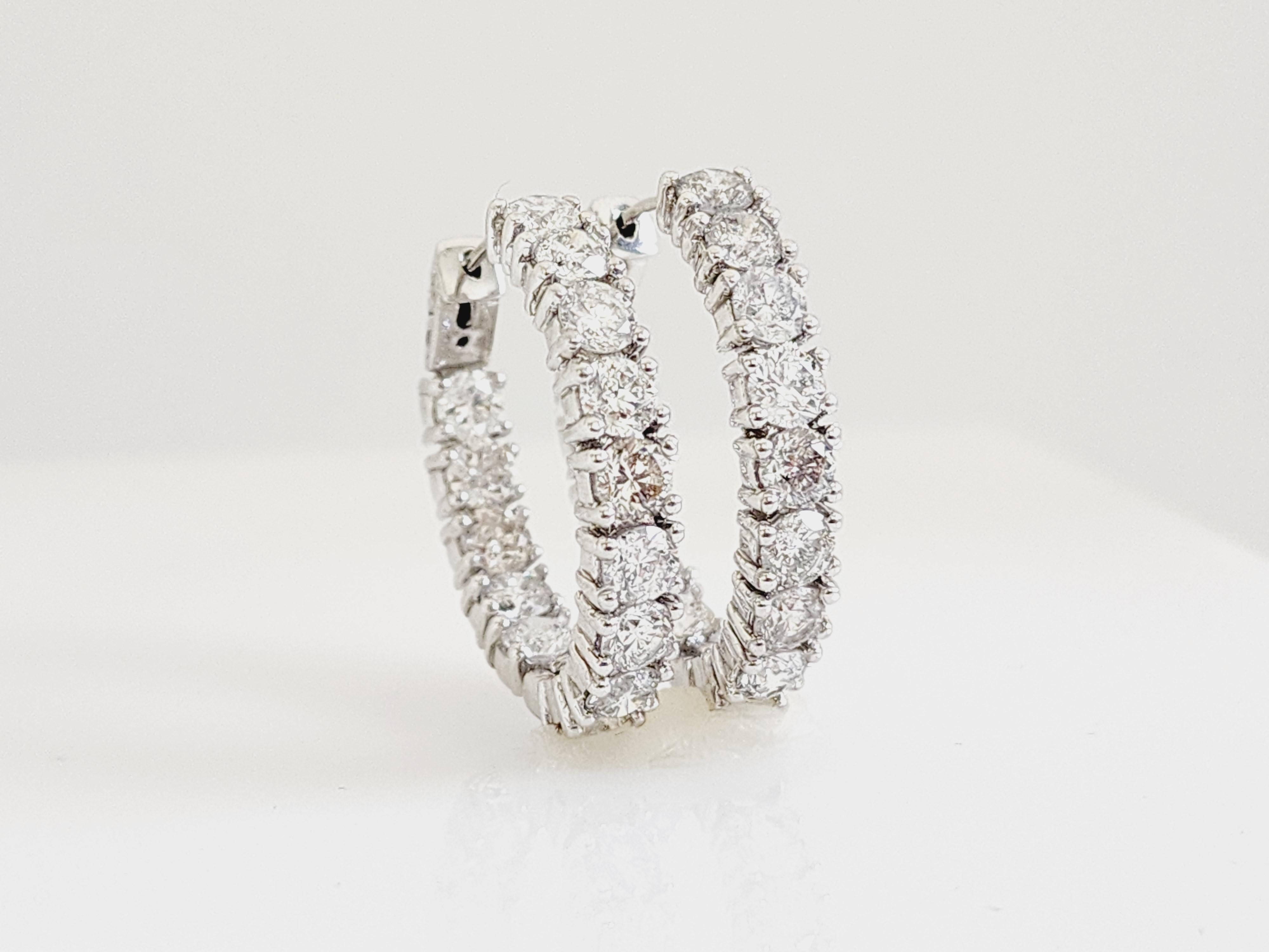Beautiful pair of natural diamond inside out oval hoop earrings in 14k white gold. 
Secures with snap closure for wear. Average Color G, Clarity SI, Measures 1inch.

*Free shipping within the U.S.*