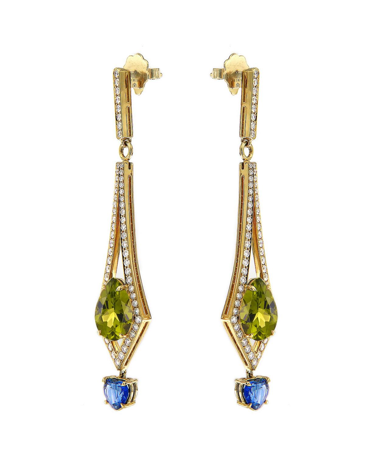 A total of 8.57 carats of clean peridot are housed within a modern and sleek form. This 18k yellow gold pair of earrings sparkle with pave white diamonds throughout. A beautiful pair of untreated heart shaped blue sapphires weighing 2.26 carats