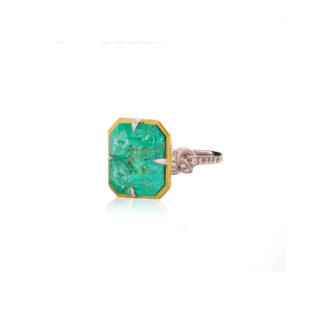 Glamorously bold and unabashedly seductive. This showstopper one of a kind ring features an intense 8.57ct natural Columbian Emerald poised between sharp eagle style talons and embraced by powerful-platinum, diamond encrusted ropes, converging to