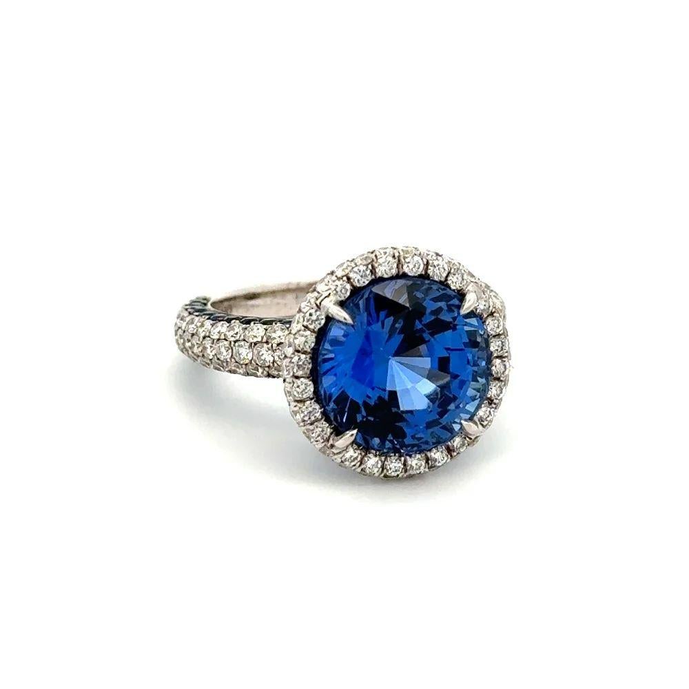 Simply Beautiful! Sapphire and Diamond Custom Gold Ring. Centering a securely nestled 8.58 Carat Round Sapphire. Surrounded by Round Brilliant Cut Diamonds, weighing approx. 1.75tcw and accented by 1.45tcw Sapphires to elevate its magnificence. Hand