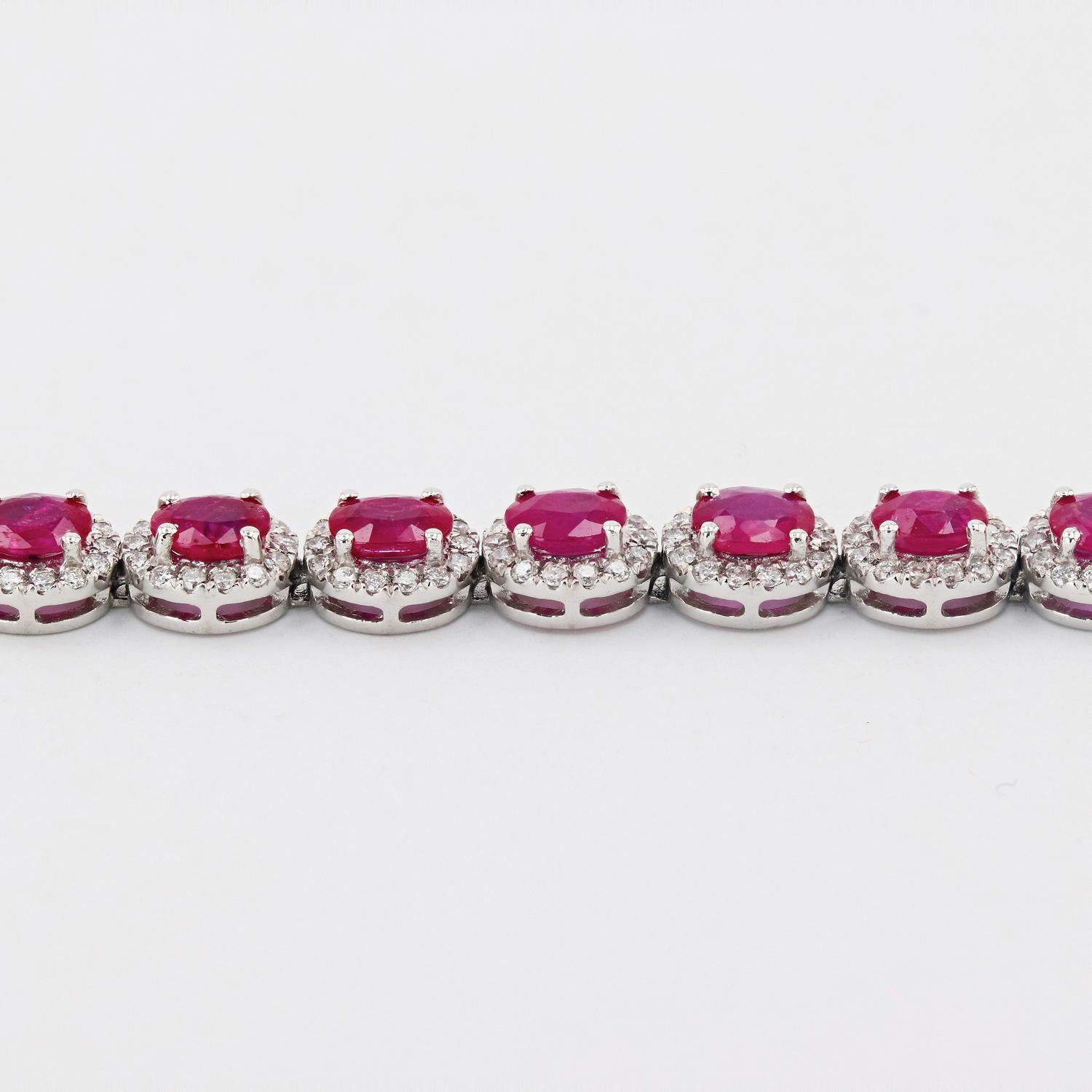 One electronically tested platinum ladies cast and assembled ruby and diamond bracelet. Condition is new, good workmanship. 

The flexible seven inch length bracelet features a series of ruby and diamond bezels, completed by a concealed clasp, with