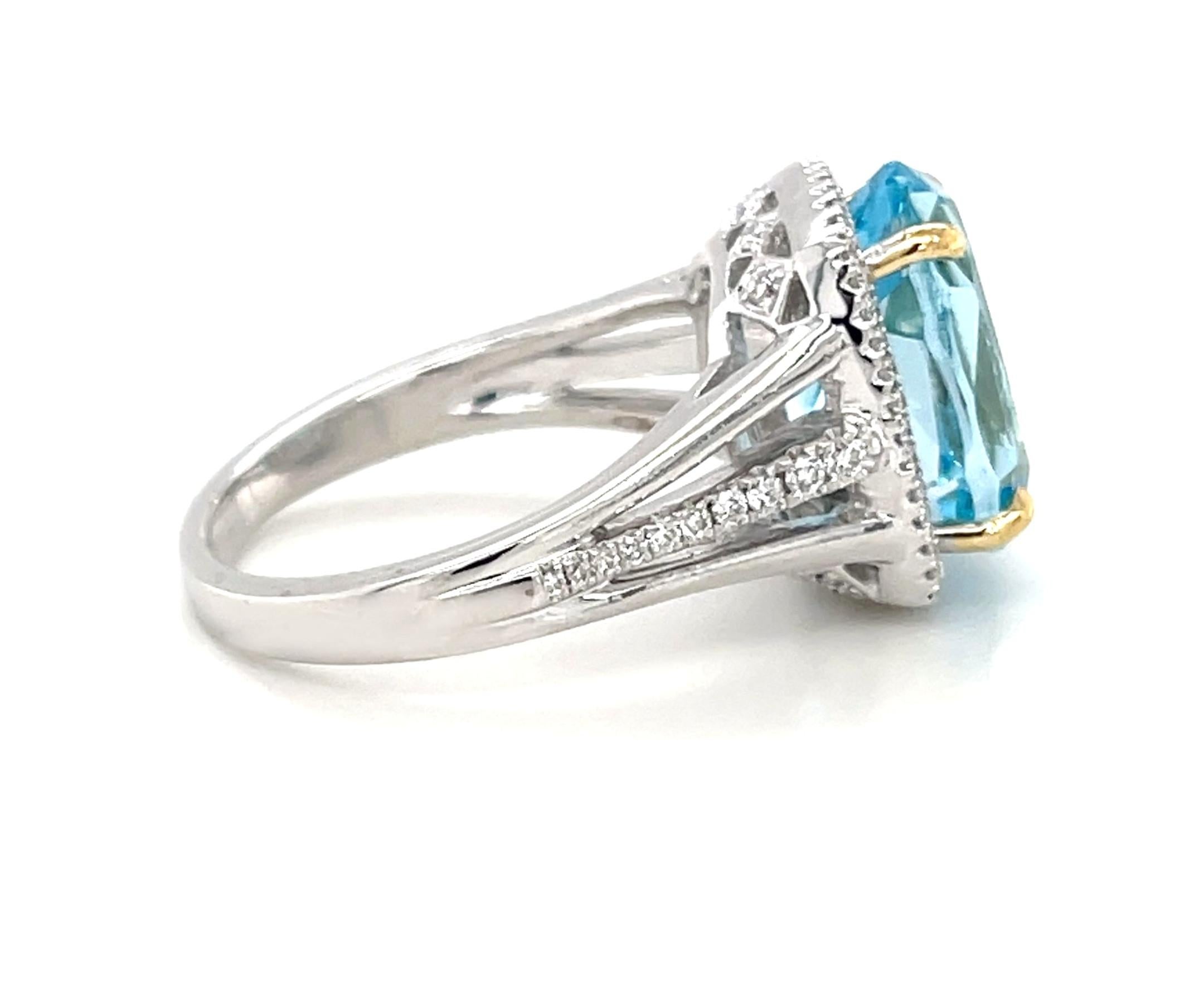 Oval Cut 8.59 Carat Blue Topaz and Diamond Halo Cocktail Ring in White and Yellow Gold For Sale
