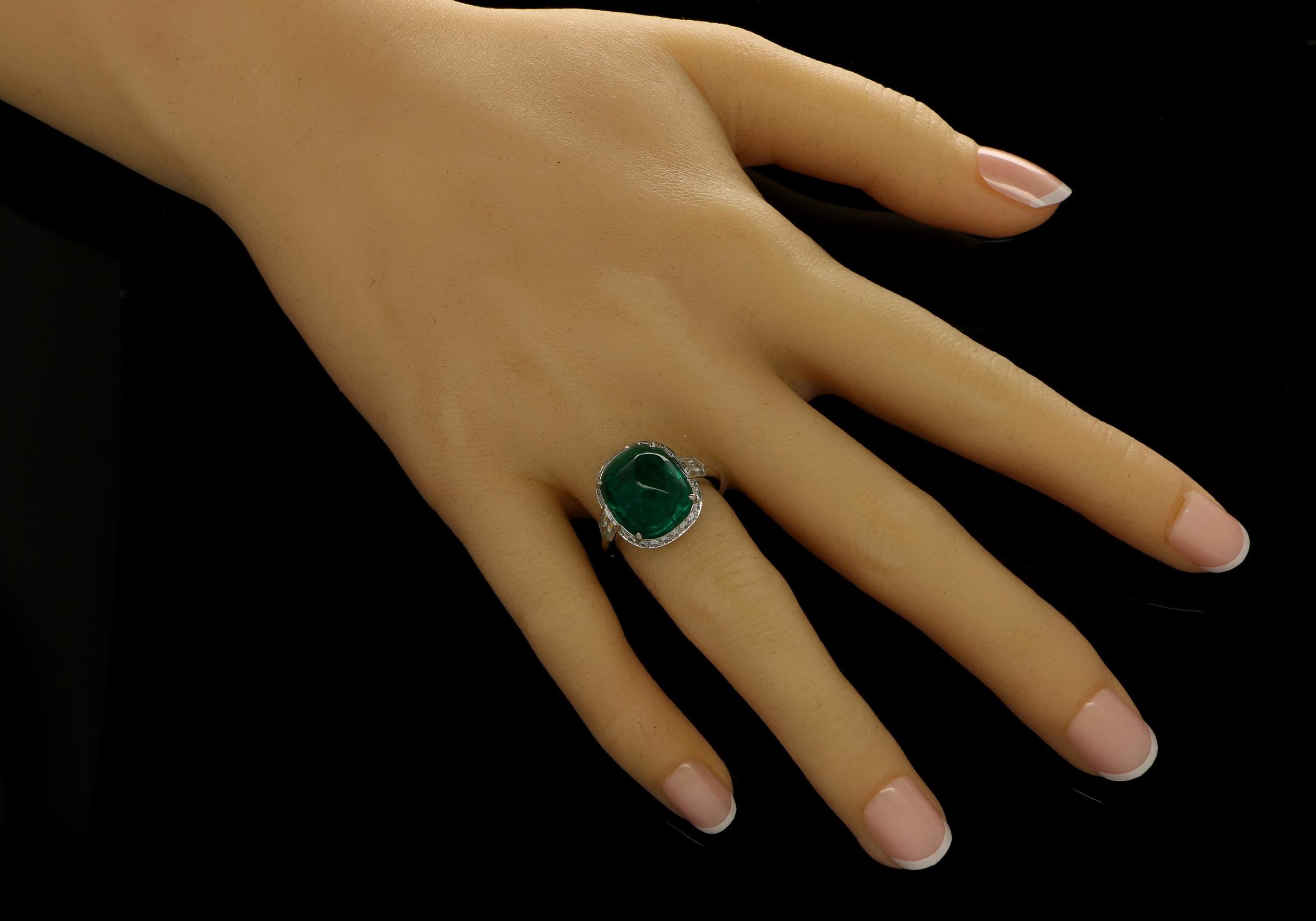 8.59ct sugar loaf cabochon Colombian emerald with AGL certificate
Pair of F+ VS+ grade bullet cut diamonds with a combined weight of 1.37cts.
Platinum with maker's signature
UK finger size L, can be adjusted to your own finger size
8.2 grams

A