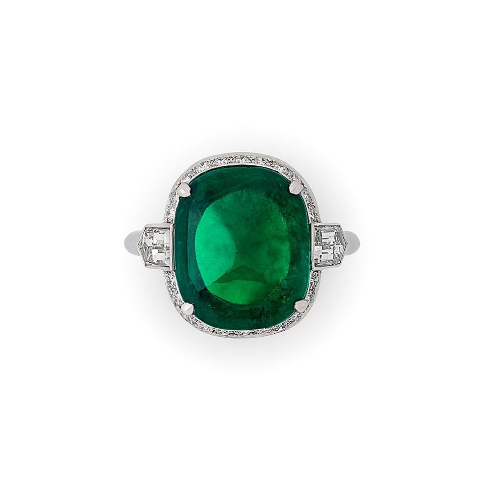 8.59ct sugar loaf cabochon Colombian emerald with AGL certificate
Pair of F+ VS+ grade bullet cut diamonds with a combined weight of 1.37cts.
Platinum with maker's signature
UK finger size L, can be adjusted to your own finger size
8.2 grams

A