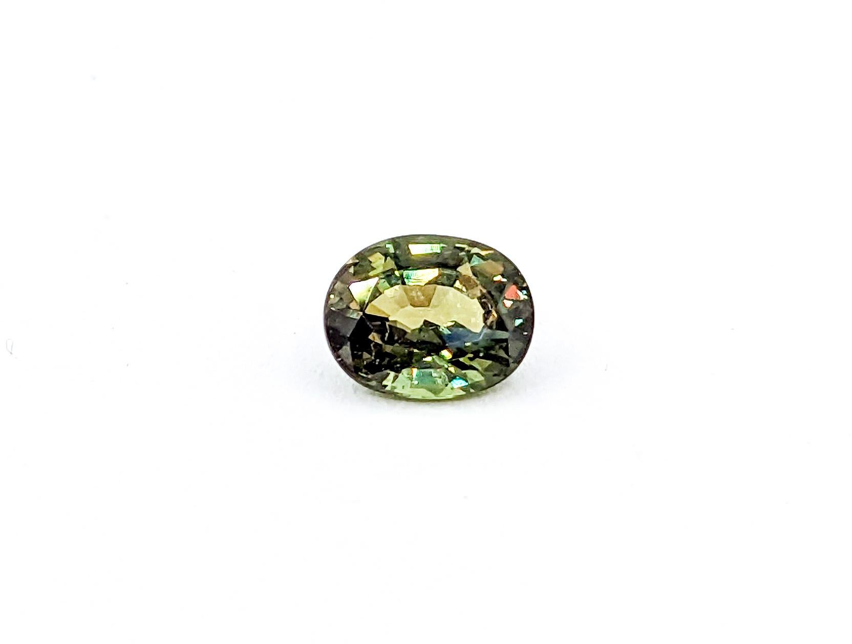 Introducing the pristine allure of an .85ct natural untreated Alexandrite. Freshly unearthed, this gem is a pure spectacle, featuring an oval brilliant cut that radiates enthralling color change from green to purple as it dances with sunlight. With