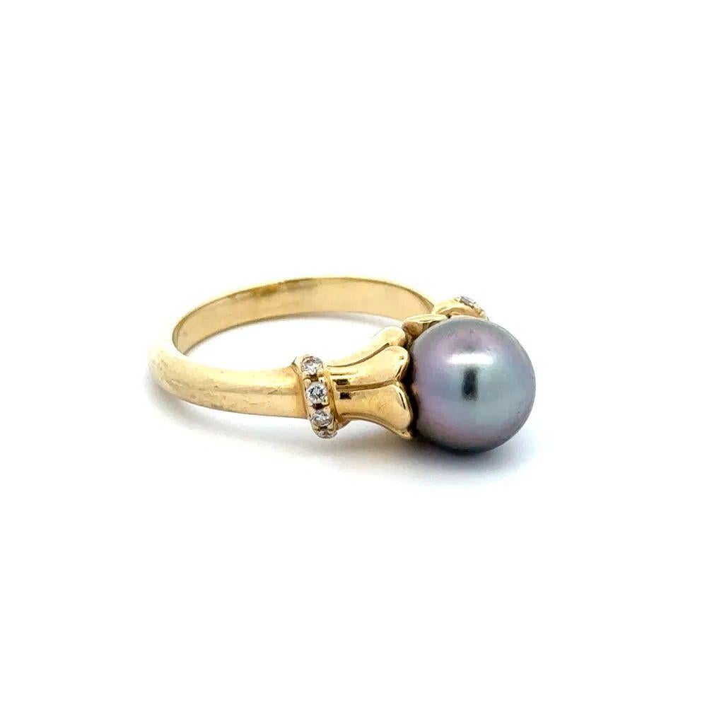 Simply Beautiful! Black Pearl and Diamond Gold Cathedral Ring. Centering a securely Hand set 8.5mm Black Pearl, enhanced with Diamonds weighing approx. 0.08tcw, set on either side of the shank. Hand crafted 14K Yellow Gold mounting. Ring size 6.5,