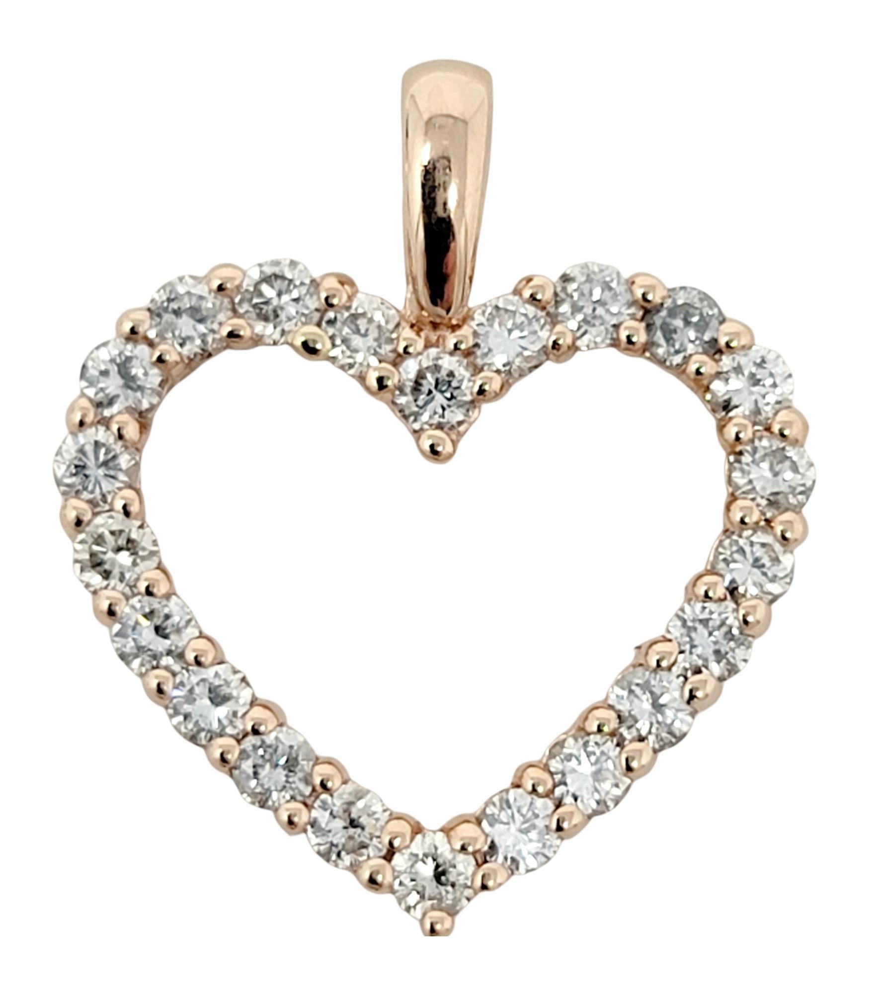 Delicate yet dazzling diamond open heart pendant in 14 karat rose gold. 

*This listing is for the pendant only, no necklace is included. 

Item type: Pendant
Metal: 14K Rose Gold
Weight: 2.10 grams
Diamond cuts: Round Brilliant
Diamond color:
