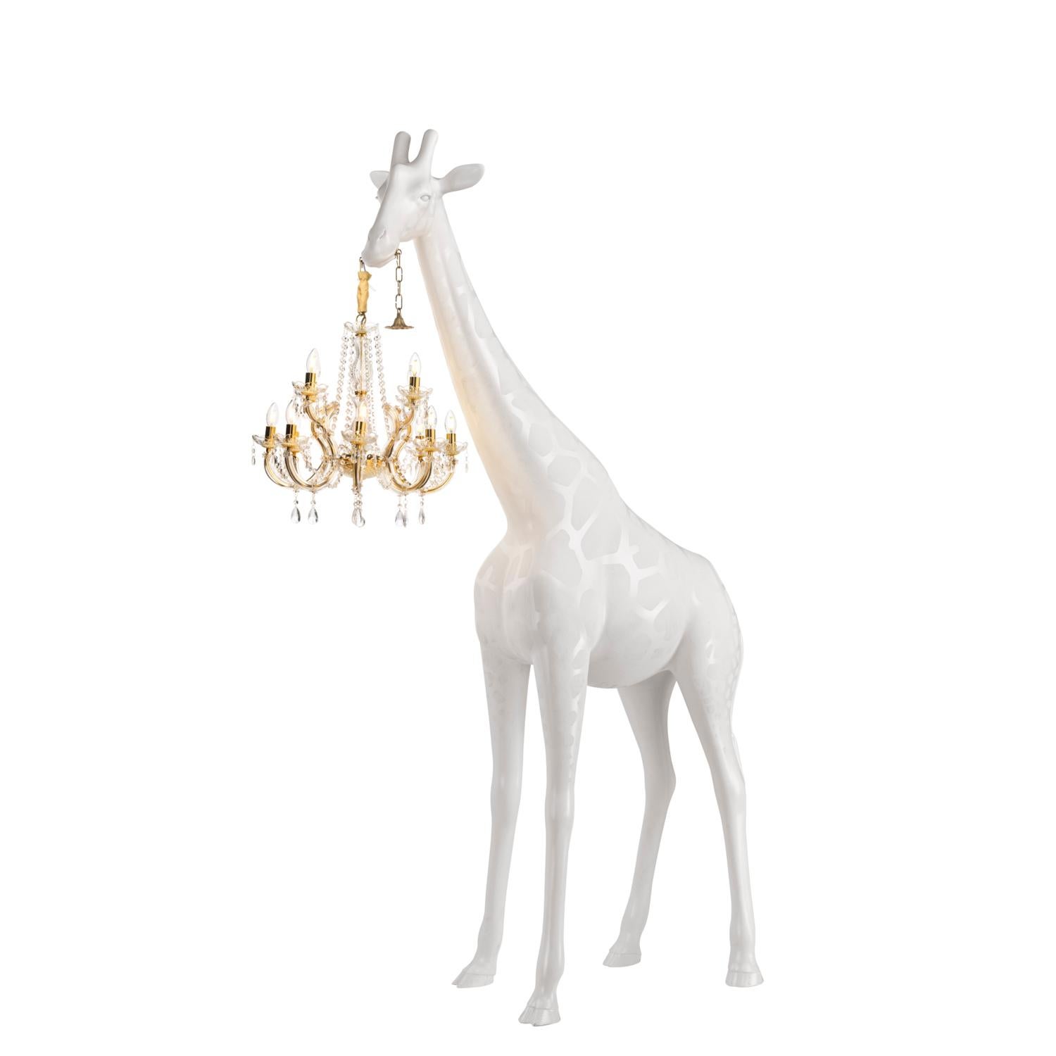giraffe holding chandelier