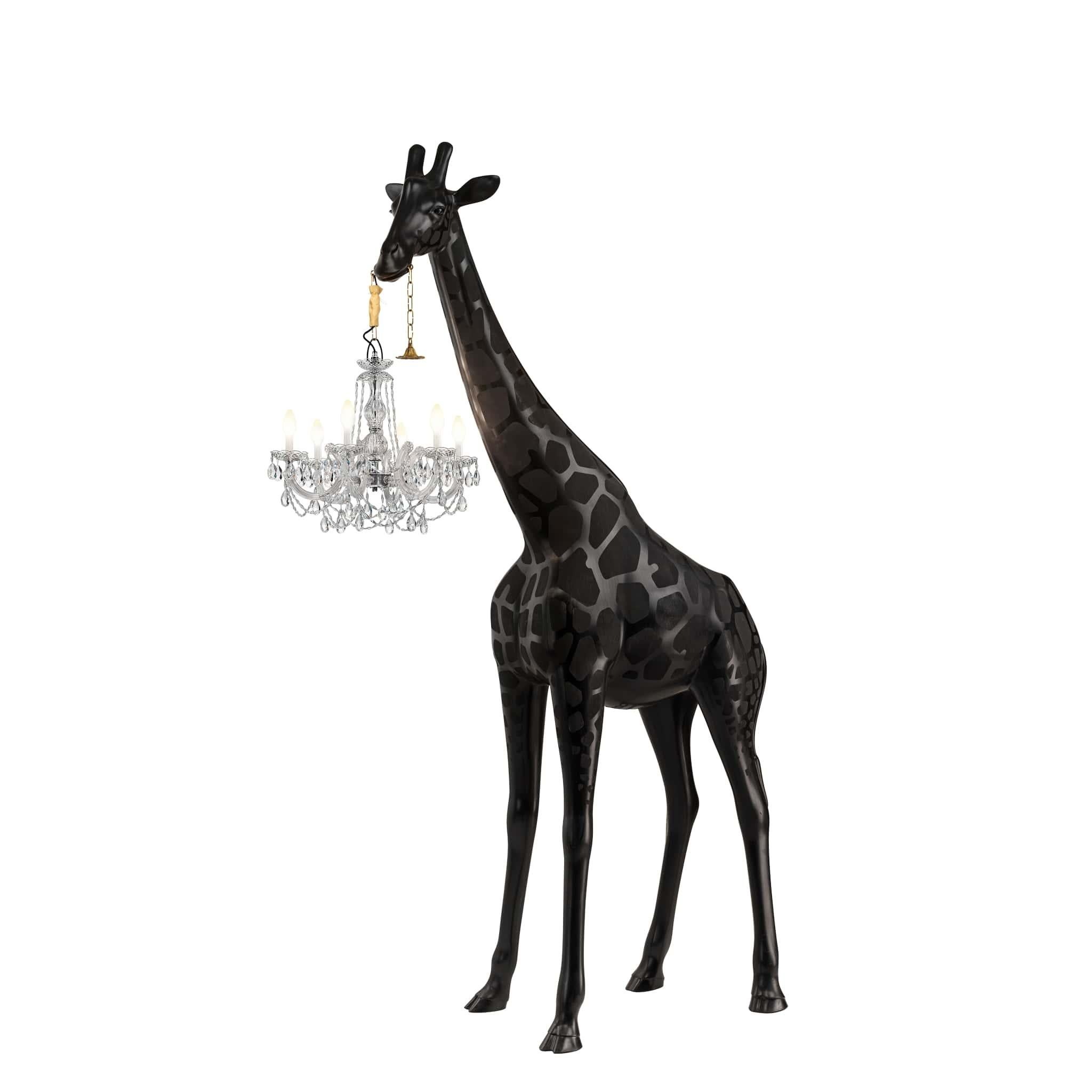 Designed by Marcantonio, Giraffe in Love M is a giraffe of 2.65 meters high that holds a classic Marie-Thérèse style chandelier, totally waterproof and IP65 certificated. Bold and elegant she is naturally gonna be the centre of attention of any