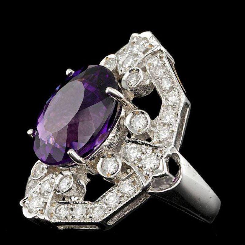 8.60 Carats Natural Amethyst and Diamond 14K Solid White Gold Ring

Total Natural Oval Shaped Amethyst Weights: Approx.  7.40 Carats 

Amethyst Measures: Approx. 14 x 12 mm

Natural Round Diamonds Weight: Approx.  1.20 Carats (color G-H / Clarity