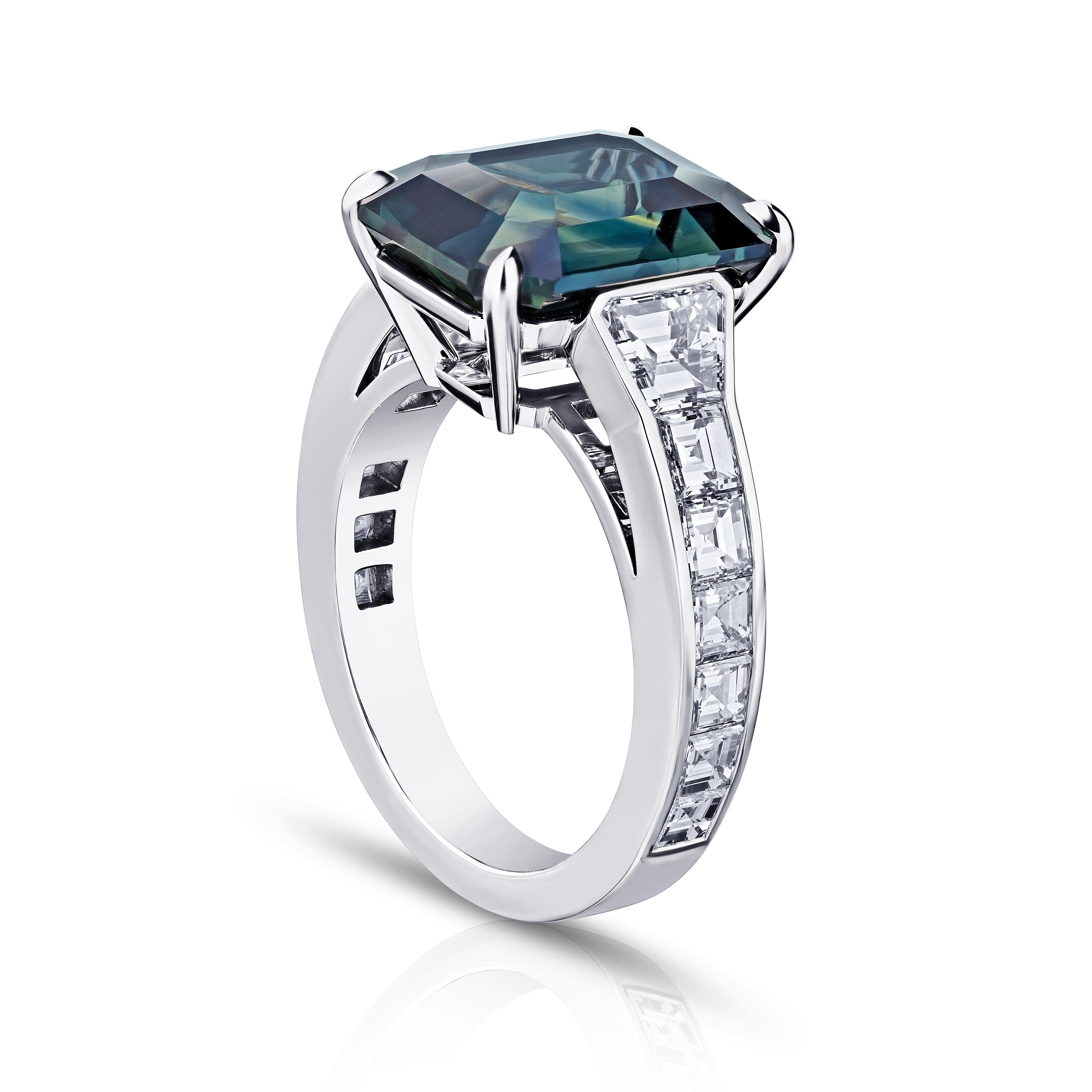 8.61 carat Emerald Cut Green Sapphire with two Trapezoid Diamonds 1.61 carats set in a handmade Platinum ring