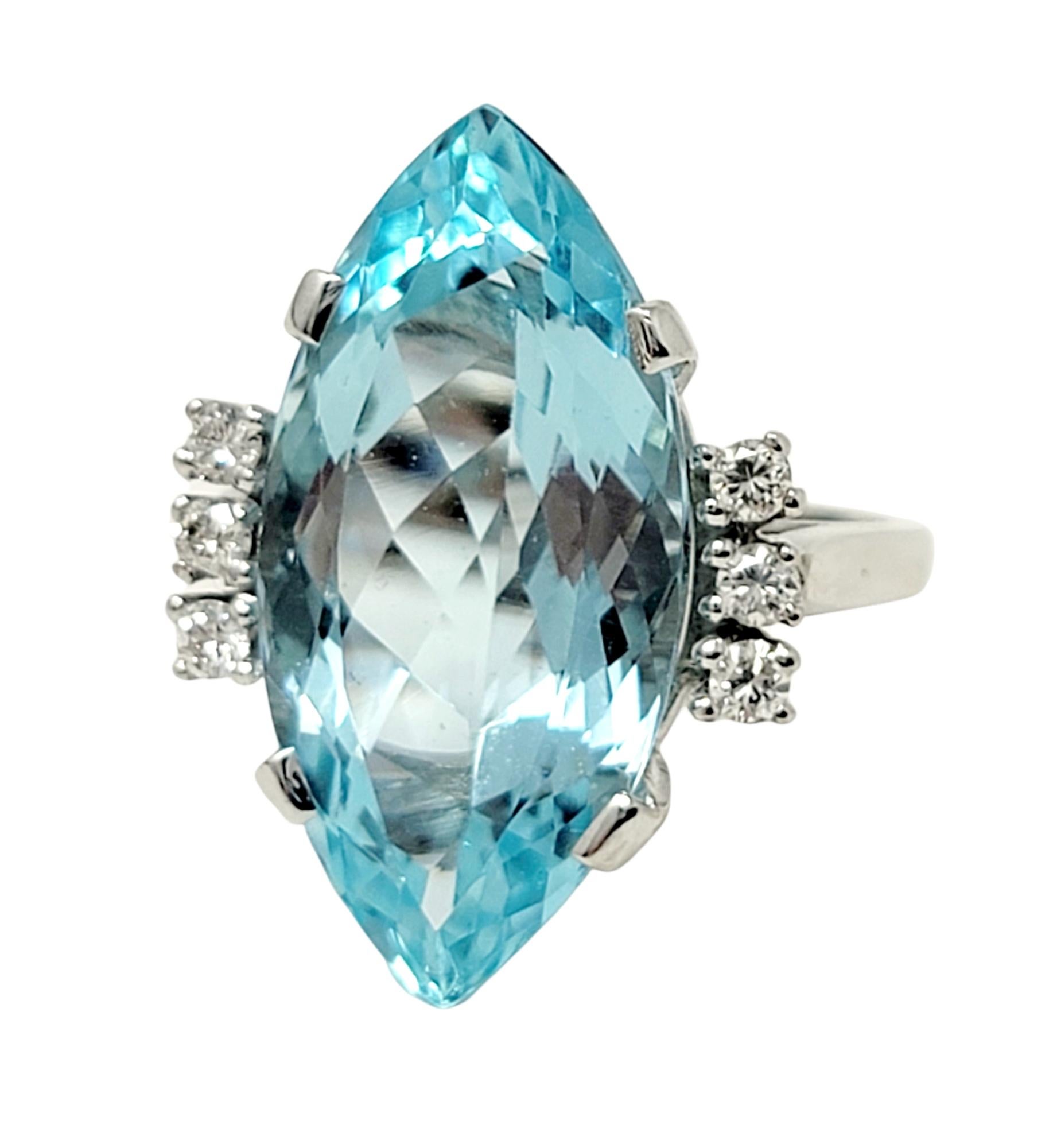Ring size: 6.5

Stunning aquamarine and diamond cocktail ring. This eye-catching piece makes a bold statement with both its impressive size and exquisite color. The incredible marquis cut aquamarine stone is 4 prong set in 14 karat white gold and