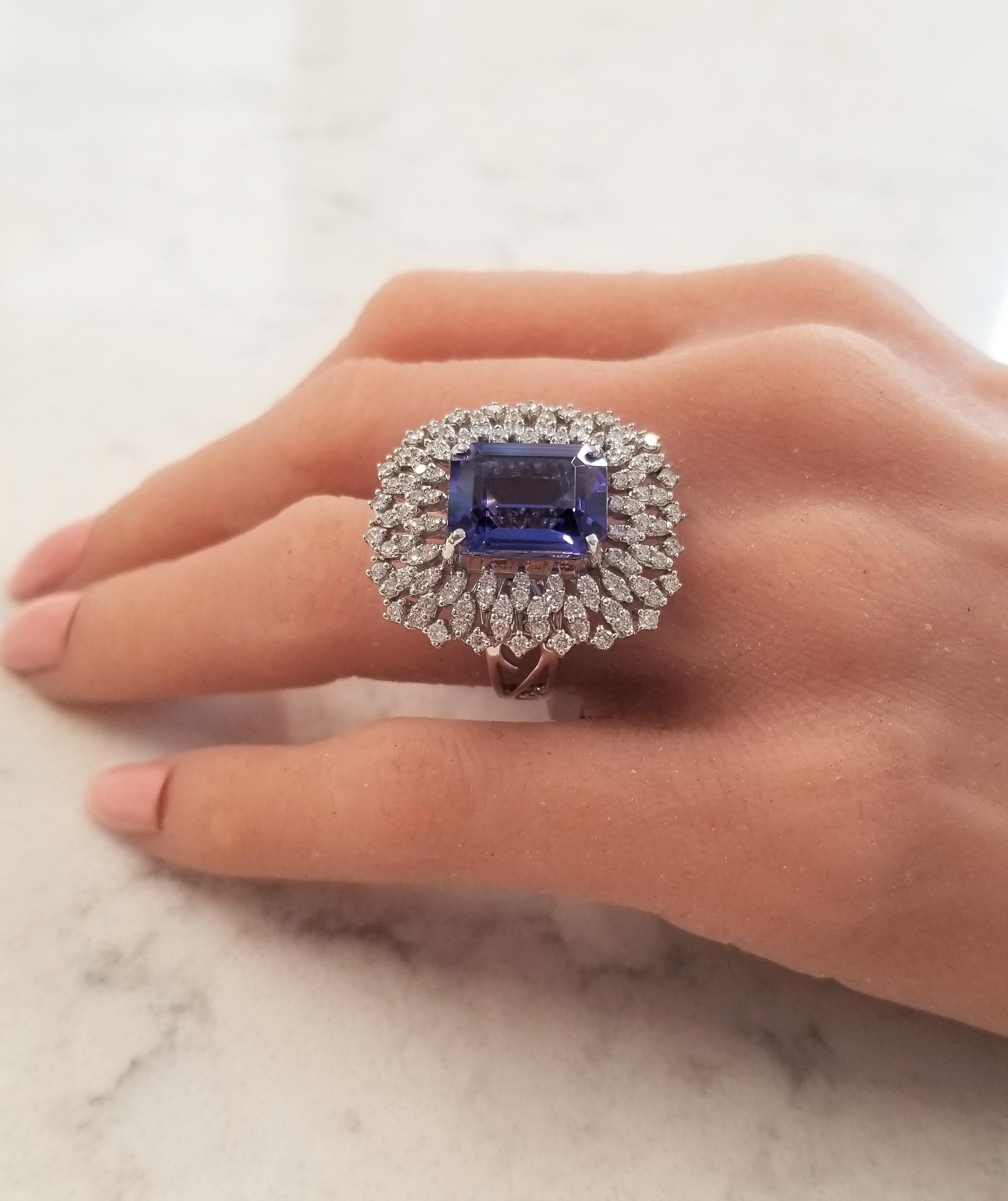This is a ring that has incredible coverage. A beautiful 8.62 carat bold blue-violet tanzanite sourced near the foothills of Mt. Kilimanjaro in Tanzania is center. It measures 10.40 x 13.50mm and is fashioned into an emerald cut. Its vivid color,