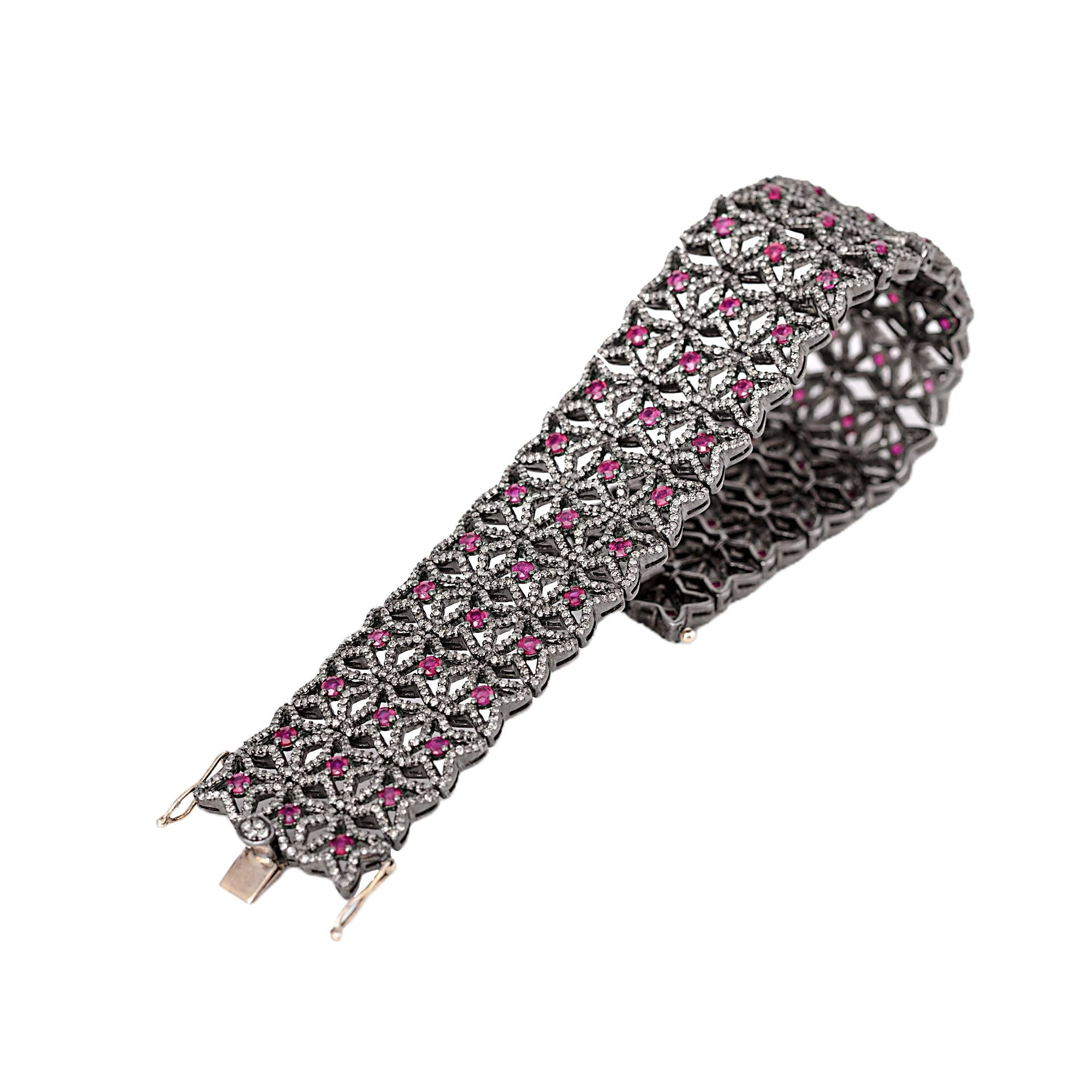 8.63 Carat Diamond and Ruby Vintage-Style Retro Bracelet

This Victorian period art-deco style magnanimous fiery red ruby and diamond star shape bracelet is impressive. The open/hollow star formed with pave set round diamond bordering the star with