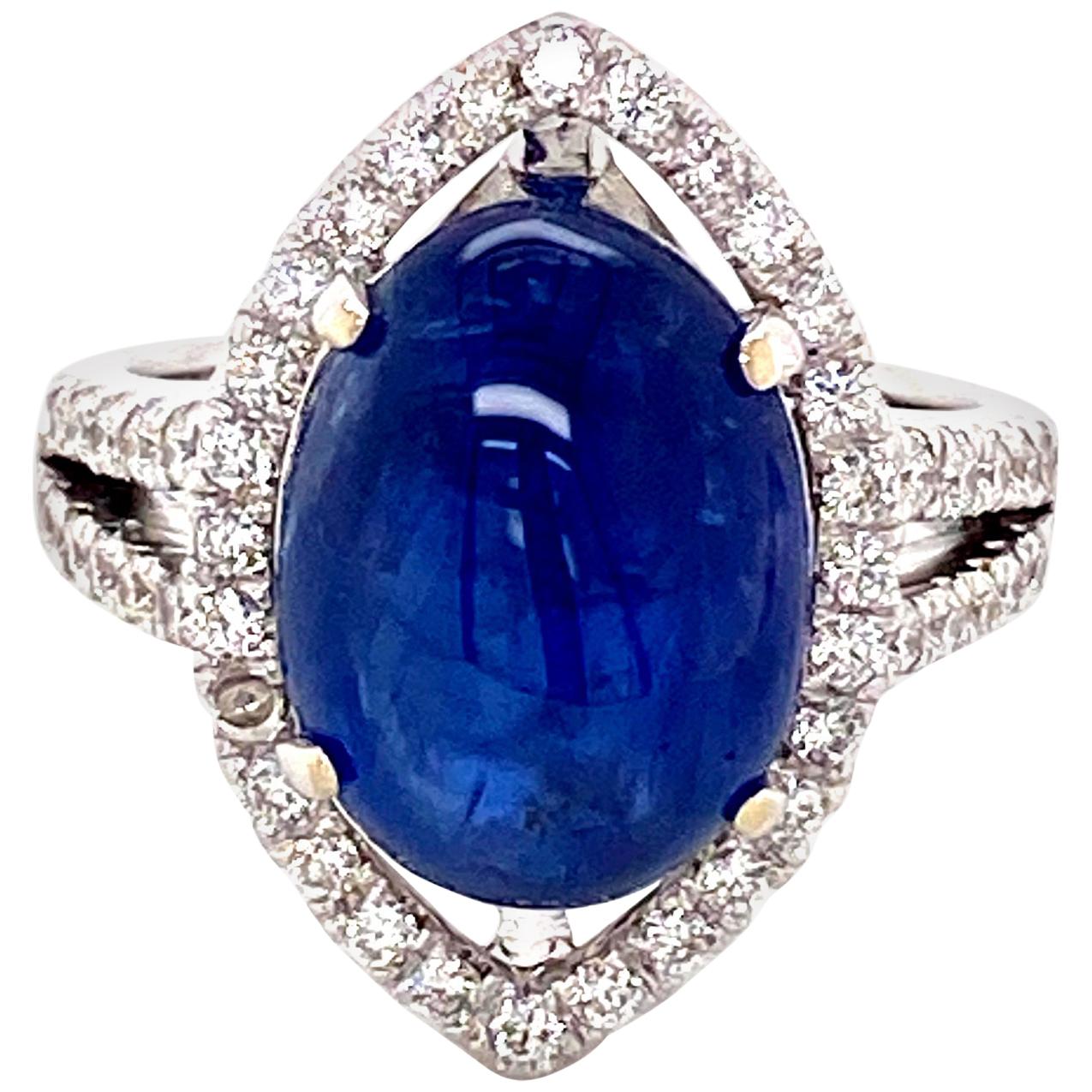 8.63 Carat GRS Certified Unheated Burmese Sapphire and White Diamond Engagement Ring:

An elegant ring, it features a beautiful unheated Burmese blue sapphire cabochon weighing 8.63 carat, certified by GRS Lab, and surrounded by white round