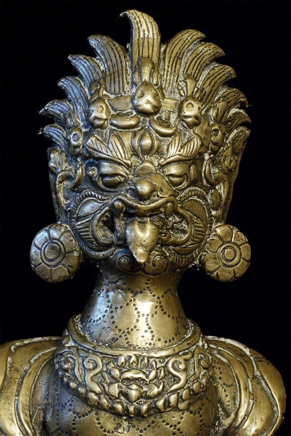 18th/19thC Nepalese bronze or brass fierce deity. I've not seen one like this before. Ten inches tall. Filled with Tantric energy. Real charisma-when there is a room filled with statues, he almost pulls people's eyeballs to him. Very well cast,