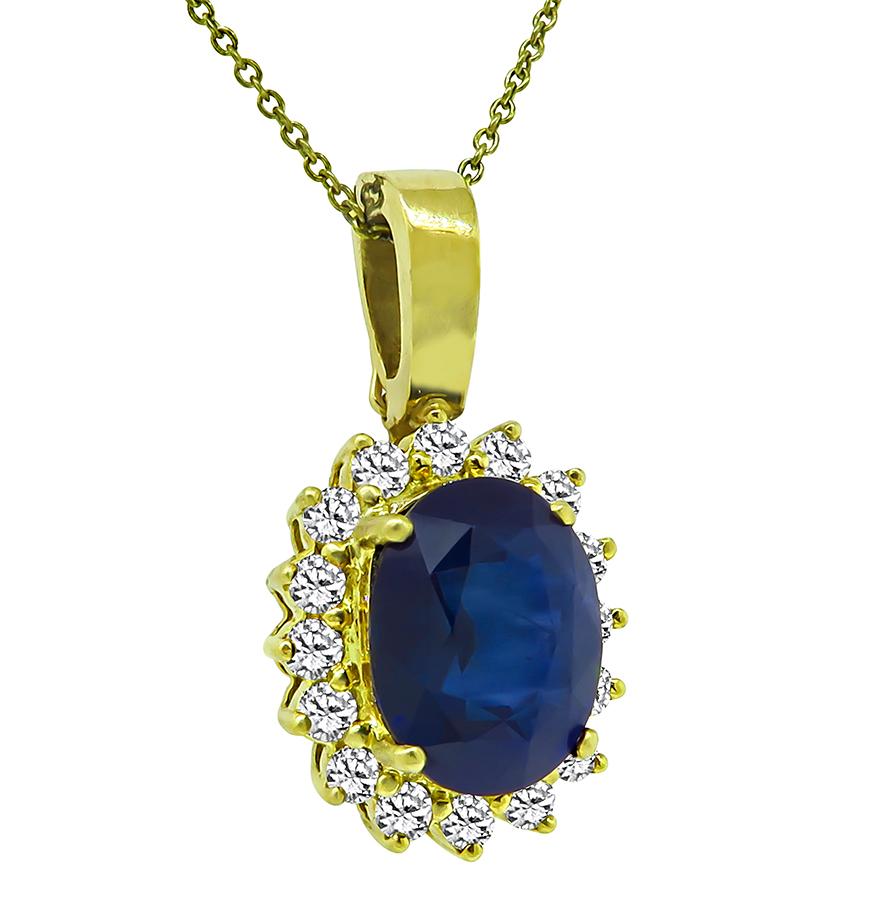 This is a charming 18k yellow gold pendant. The pendant is set with lovely oval cut sapphire that weighs approximately 8.64ct. The sapphire is accentuated by sparkling round cut diamonds that weigh approximately 1.25ct. The color of these diamonds