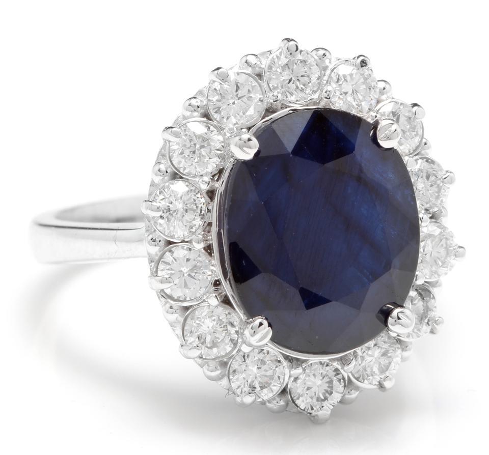8.65 Carats Exquisite Natural Blue Sapphire and Diamond 14K Solid White Gold Ring

Total Blue Sapphire Weight is: 7.55 Carats (Treated)

Sapphire Measures: 12 x 10mm

Natural Round Diamonds Weight: 1.10 Carats (color G-H / Clarity SI1-SI2)

Ring