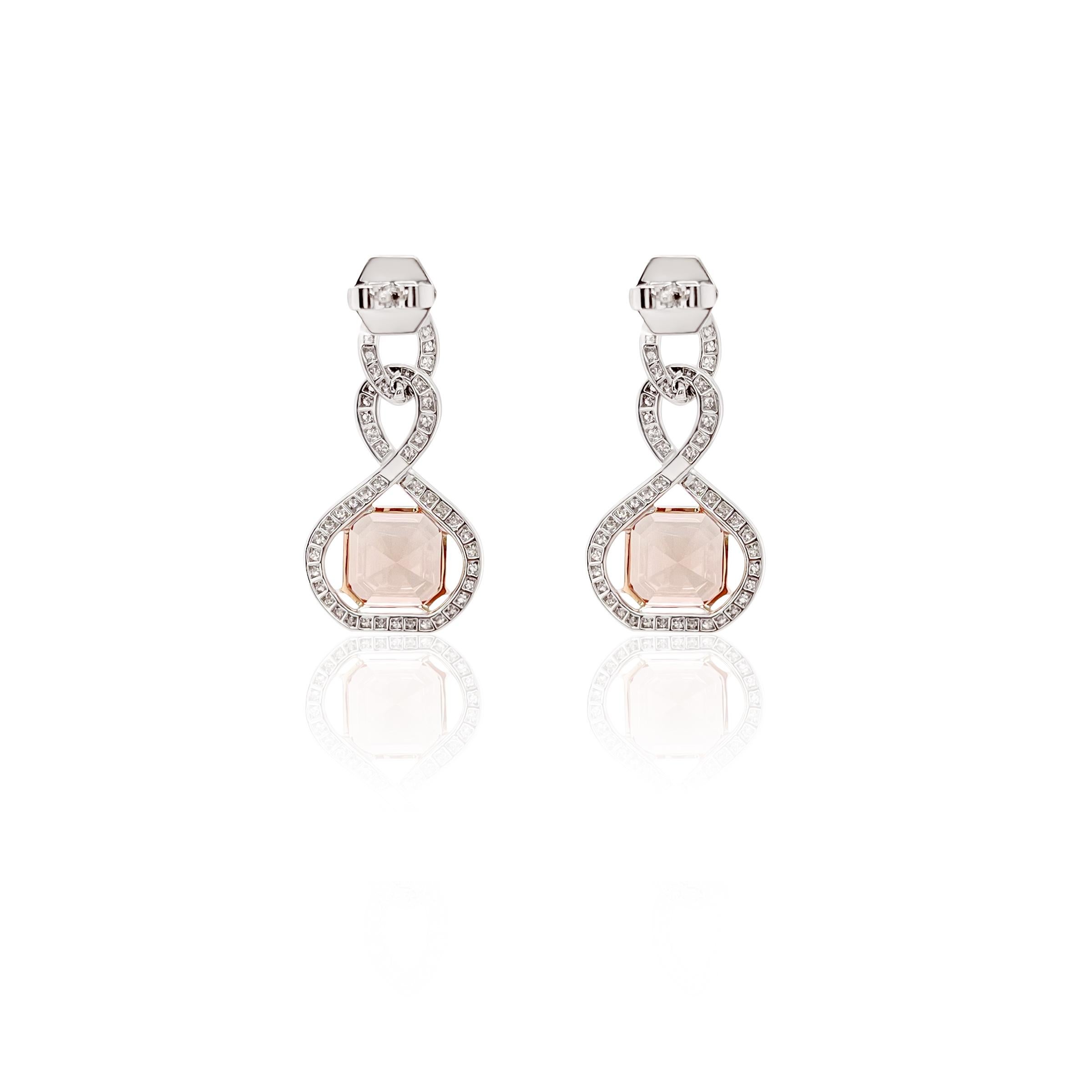 These peach tourmaline and diamond earrings make a bold and stunning statement while offering delicate sparkle. The perfectly cut pair of faceted ascher cut tourmalines are adorned with pave'd diamonds set in 18k white gold which add sparkle and is