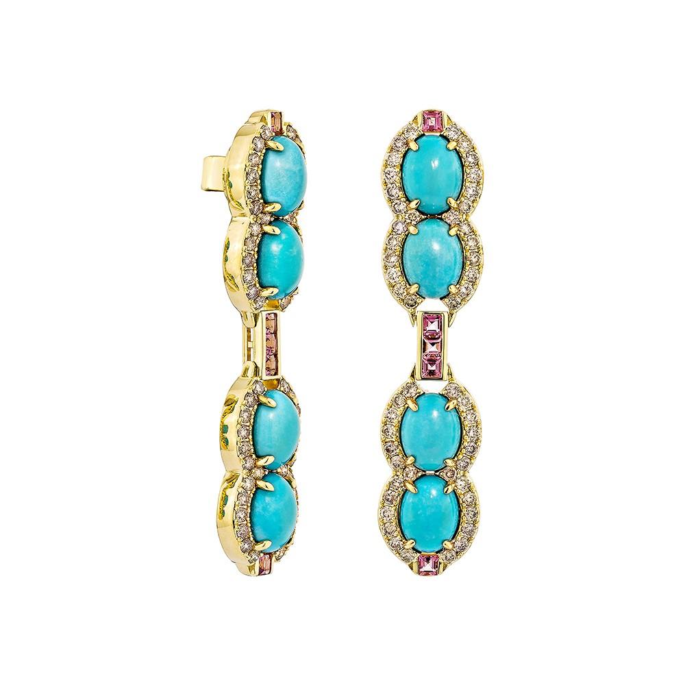 Sunita Nahata presents a one-of-a-kind Piece of Turquoise Earrings set in a traditional oval cut. These earrings reflect the style and elegance that modern women desire, with the stones arranged in a straight line and in the middle pink tourmaline