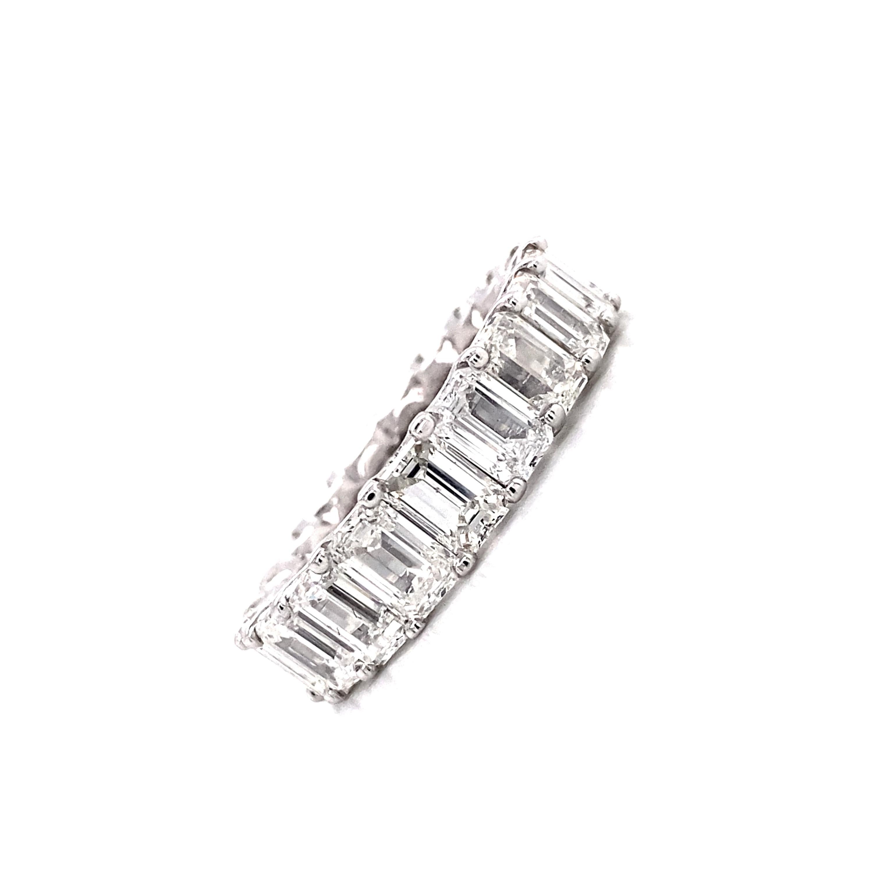 Emerald Cut Diamond Eternity Band

The diamond eternity ring is an enduring emblem of commitment and love, and its emerald cut shape pattern offers a slightly unique twist to this timeless piece. This large diamond eternity ring features a full