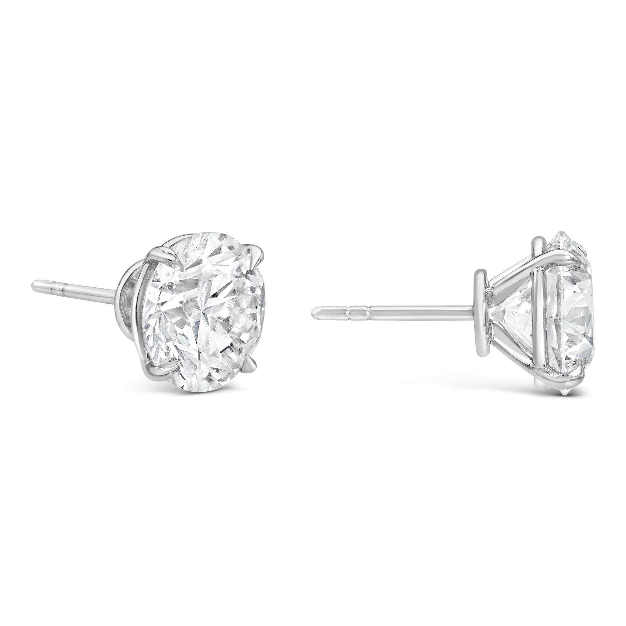 A timeless pair of solitaire stud earrings, showcasing two round brilliant cut diamonds weighing 8.65 carats total with I-J color and SI1-SI2 clarity, each set on a classic four-prong setting finely made of platinum. Perfect for casual wear. 

Roman