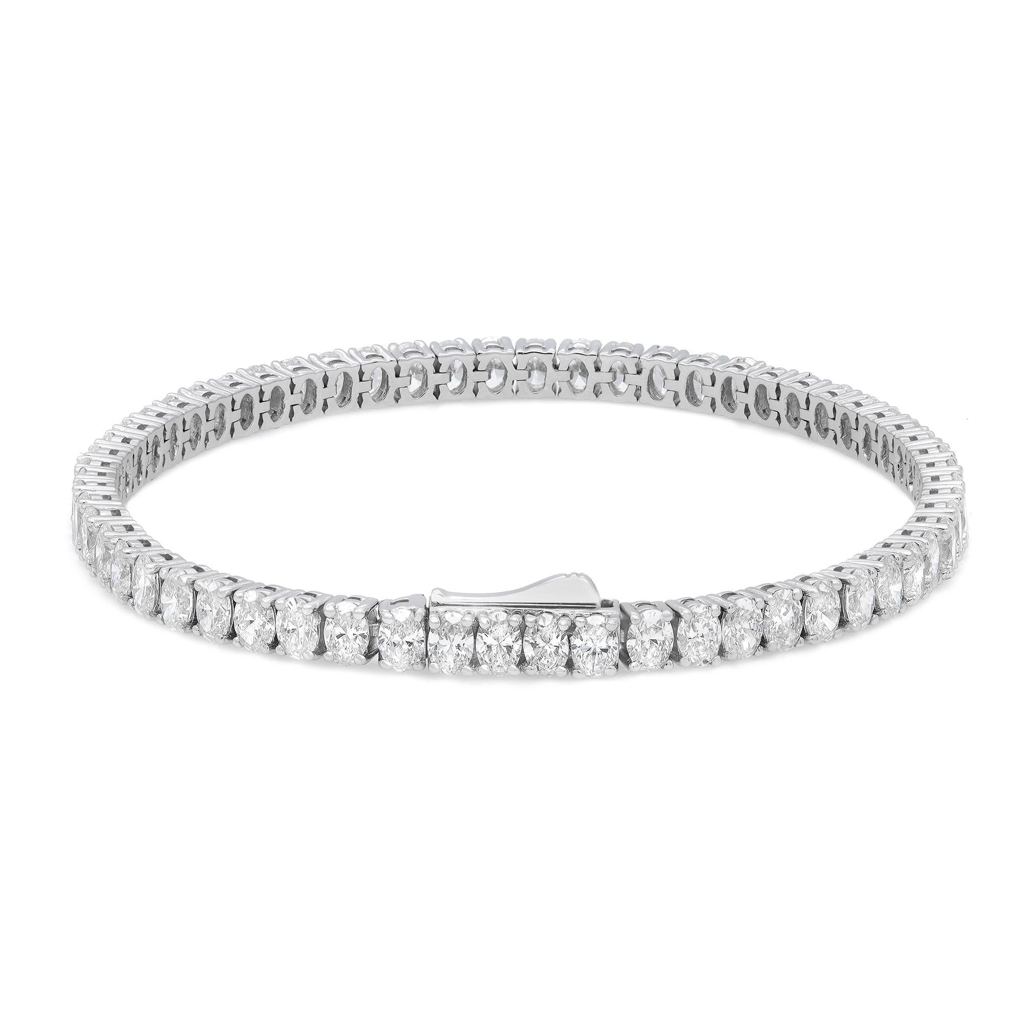Get a classic look with easy elegance. This diamond tennis bracelet  expertly crafted in 18K white gold. Features 60 prong-set dazzling oval cut diamonds with a total weight of 8.65 carats. Diamond color I and VS-SI clarity. Bracelet length: 7