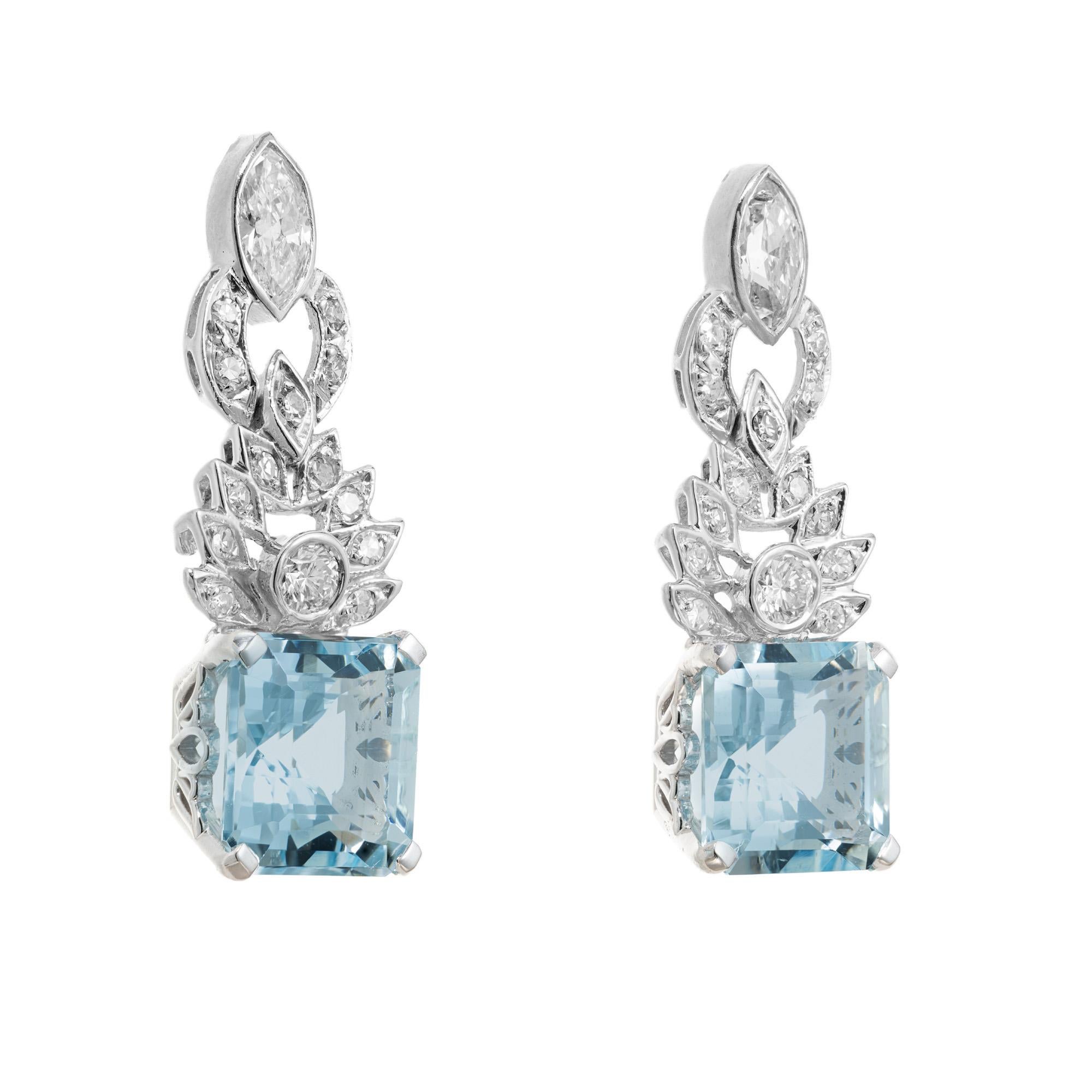 1950's Spectacular vintage mid-century aquamarine and diamond dangle earrings. 2 square cut aquamarine gemstones totaling 8.66cts set in platinum four prong settings. Accented with 1.32cts if marquise, round brilliant cut and single cut diamonds in