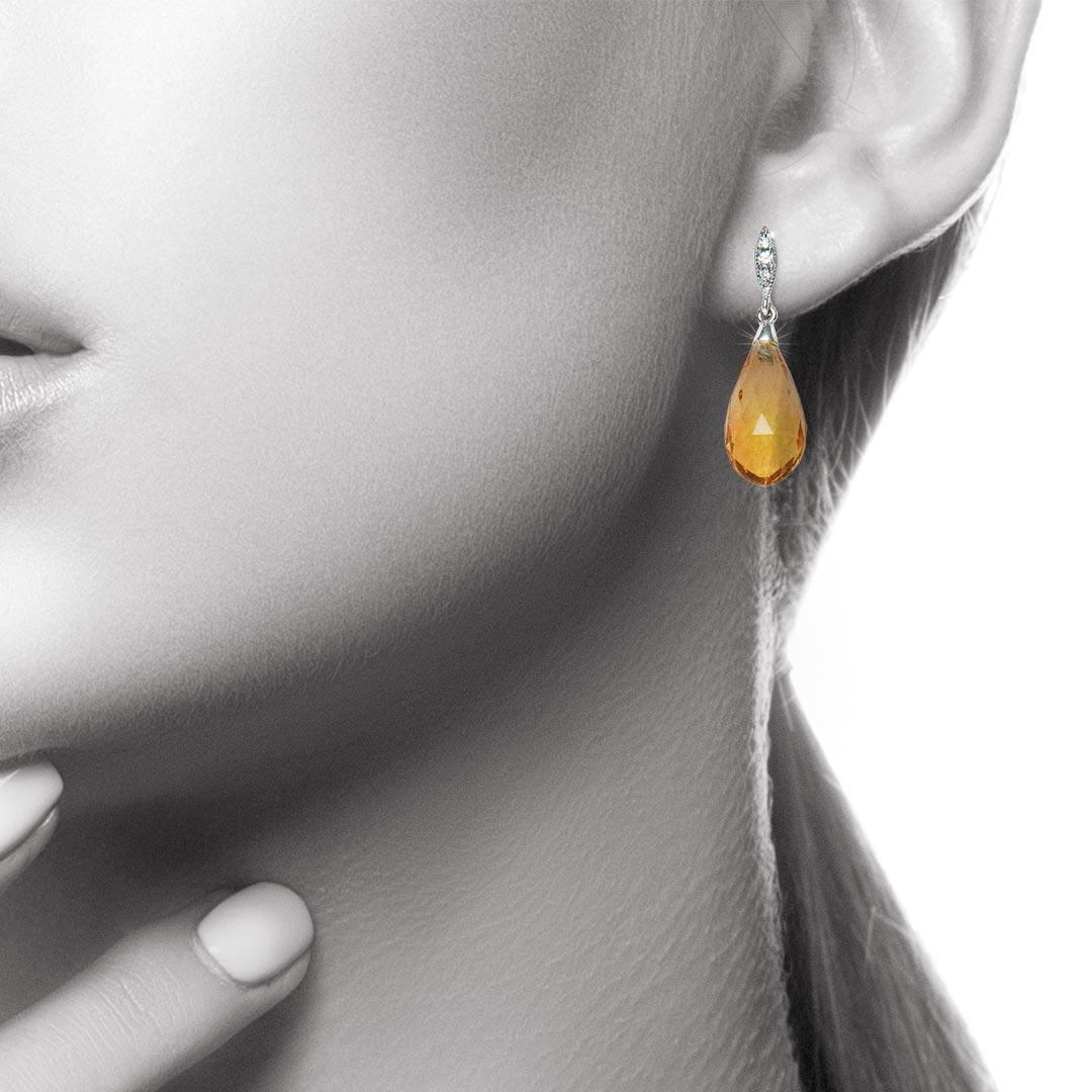 The bright colour of the Citrine Briolettes is beautifully complemented by pavé-set Diamond fittings to create earrings that are stunning in their simplicity. The Citrines weigh a total of 8.66 carats and the total diamond weight is 0.04 carat,