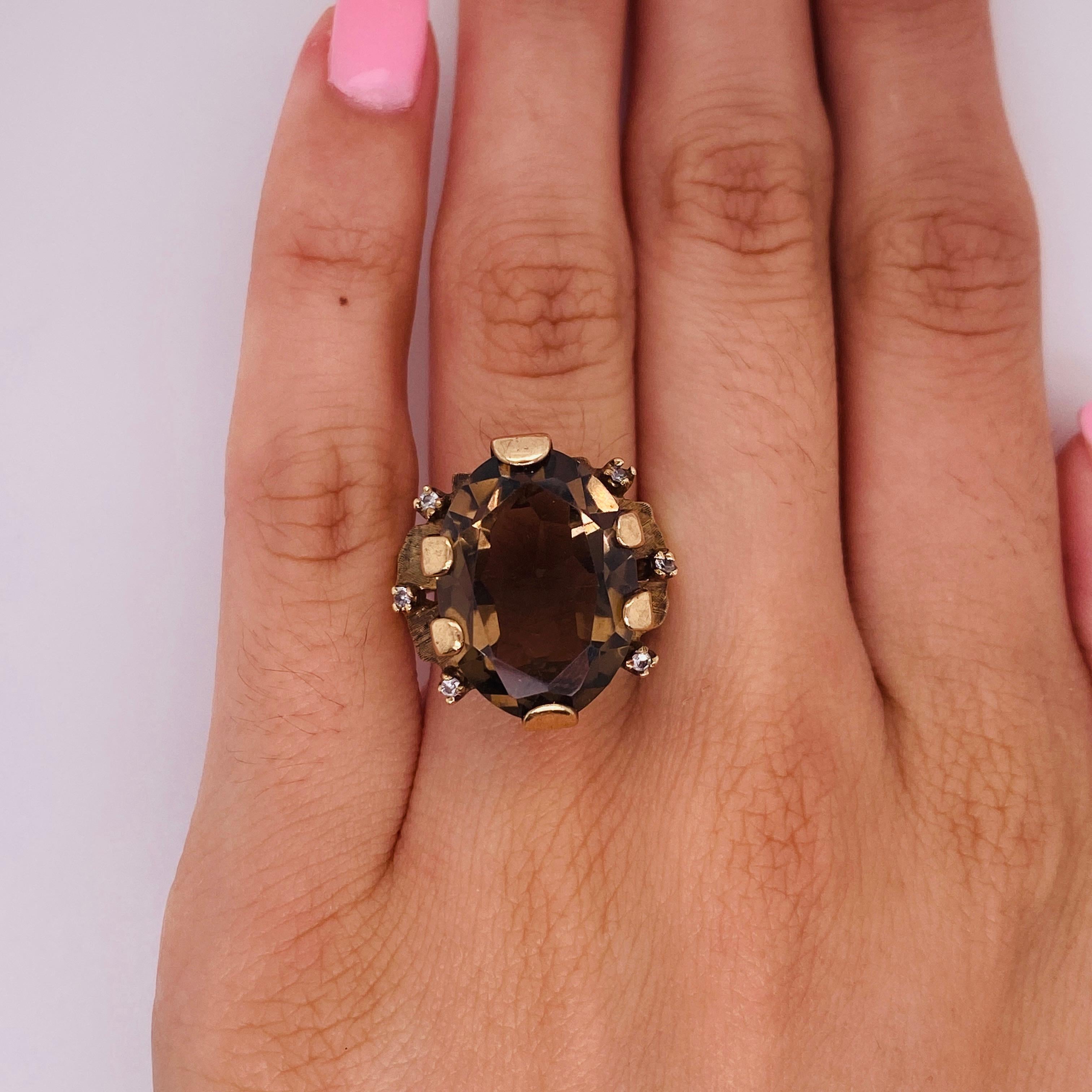 This 8.66 ct smokey quartz ring is totally unique and will look fabulous on your finger. The oval smokey quartz gemstone is set with six flat prongs and accented with six small diamonds that have a total weight of .08 carats. The solid 10 karat