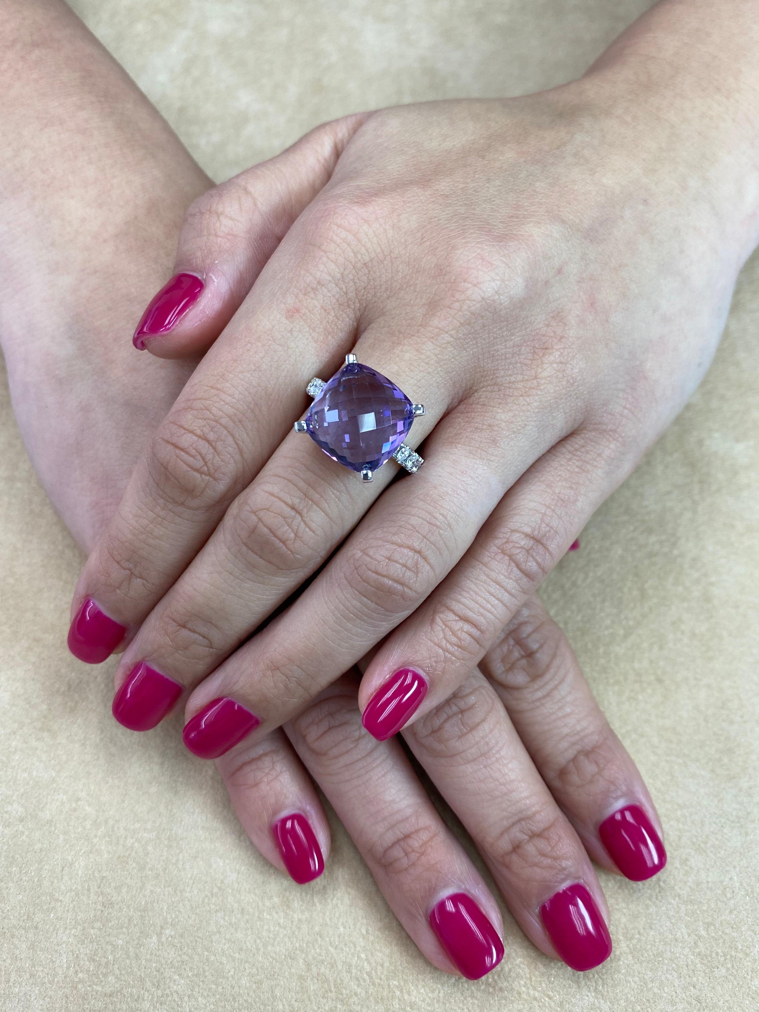 Here is a classic cocktail ring with good size and nice color. This cocktail ring is set in 18k white gold, a top quality faceted Amethyst and brilliant white diamonds. The center Amethystis (8.67 Cts) is of top quality with excellent purple color