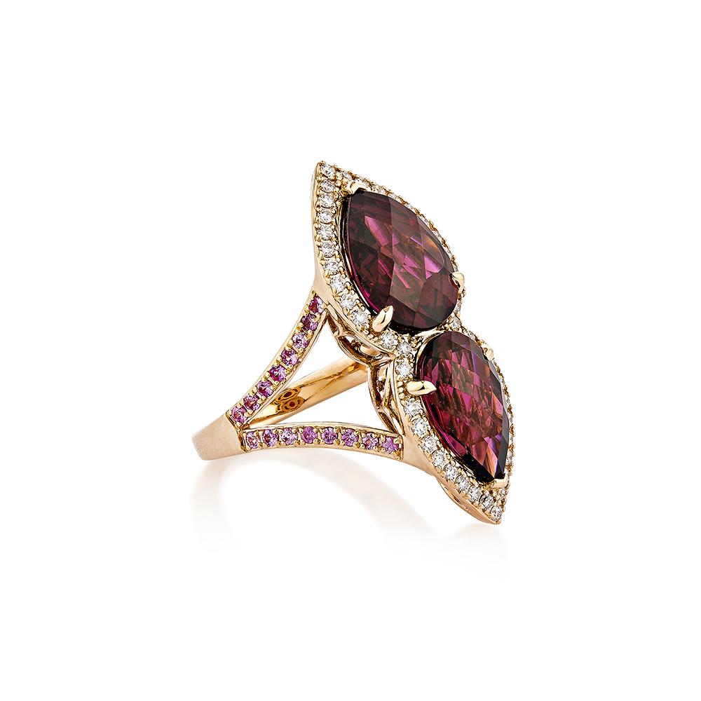 A gorgeous and one-of-a-kind rhodolite ring in two pear shapes with a checkerboard cut was displayed. This ring reflects the level of quality and elegance that modern women wish for. This rose gold ring has been accented with white diamonds to
