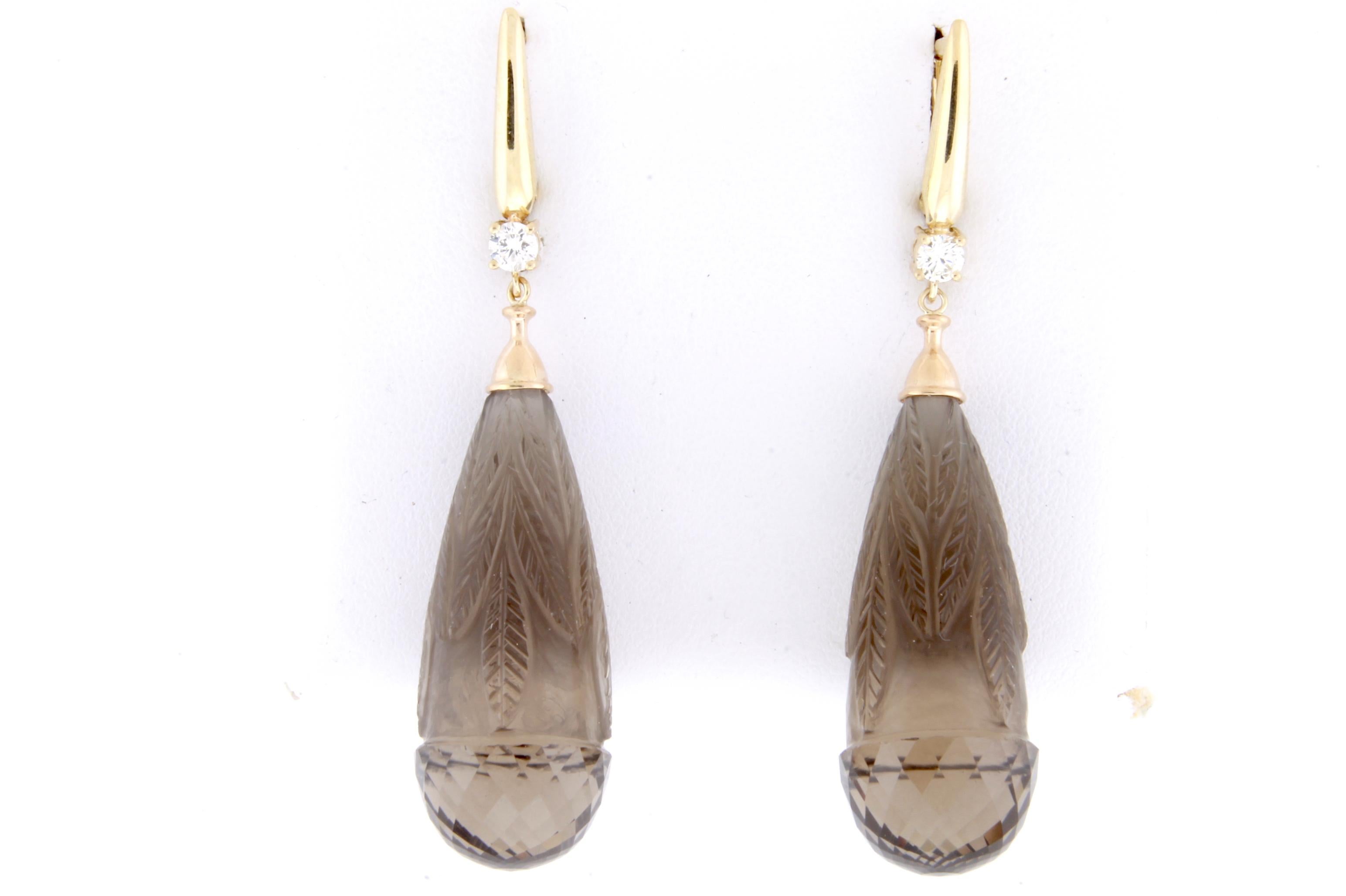 When these Smokey Quartz stones came across our desk, we knew exactly what to do with them. At 86.75 Carats, these drop earrings are a show stopper. Mounted on a 14k Yellow Gold setting with 2 diamonds, these earrings were created with Alberto's top