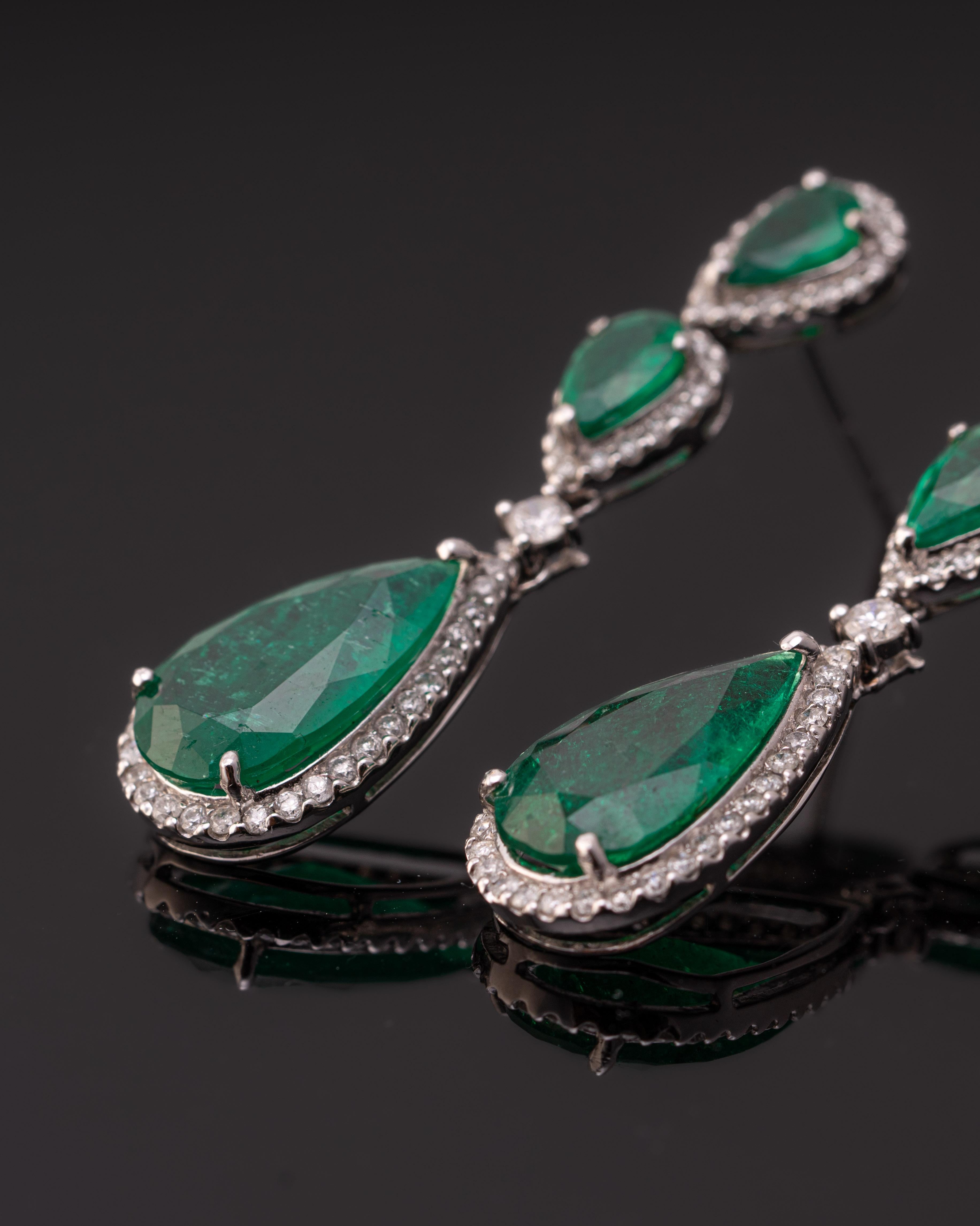 A beautiful pair of dangle earrings, with 8.68 carat pear shaped Emeralds and 1.18 carat White Diamonds, all set in 18K White Gold. The earrings come with a push-pull backing, and are around 4cm long. 
Please message for more information. 
We