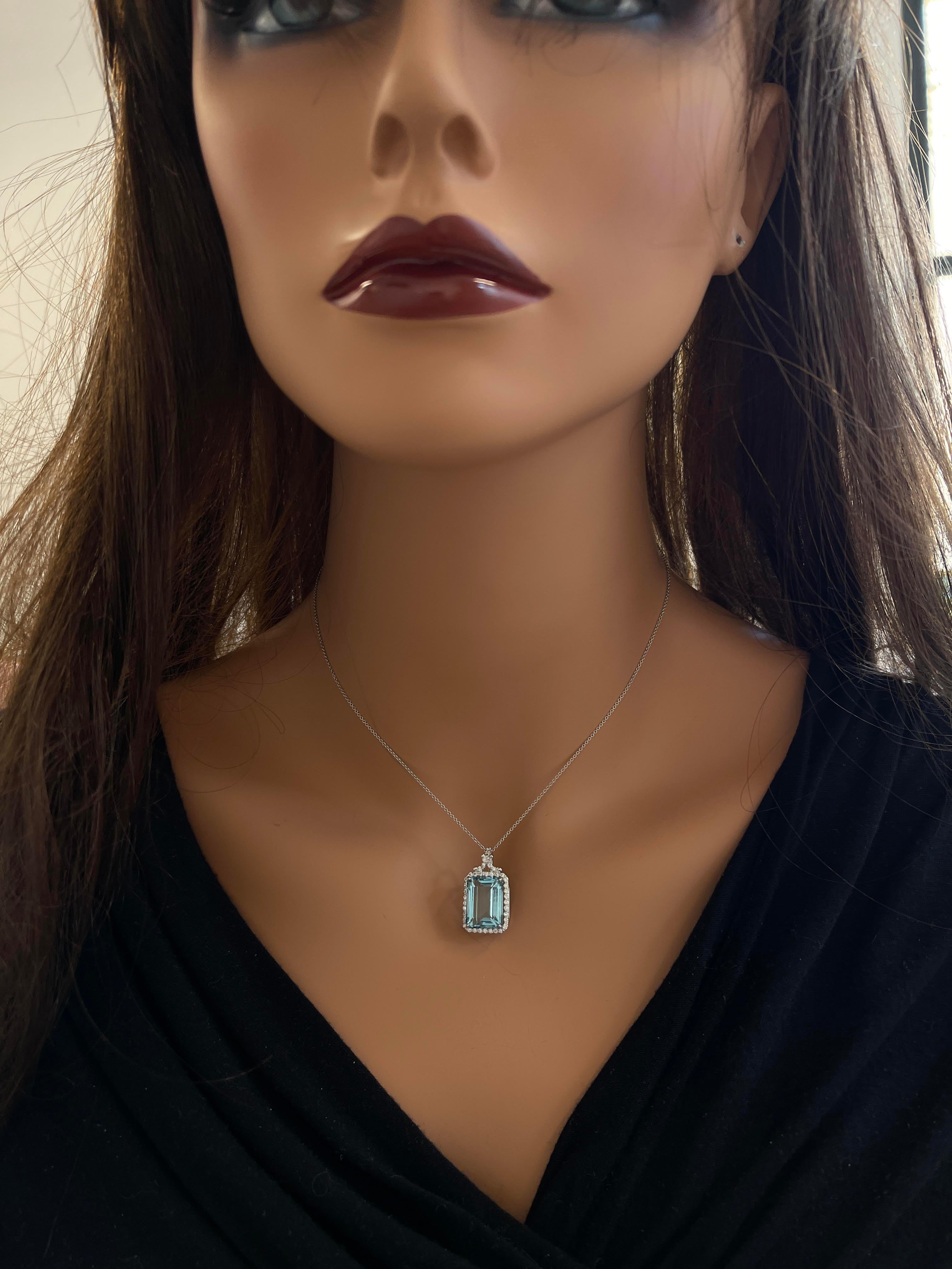 Gorgeous And Classic Emerald-cut Halo Pendant Features An Aquamarine weighing 8.68 carats. The gem source is Brazil. Framed by 1.00 Carat Of Round Brilliant Diamonds Set in 18k White Gold, this is the classic necklace.