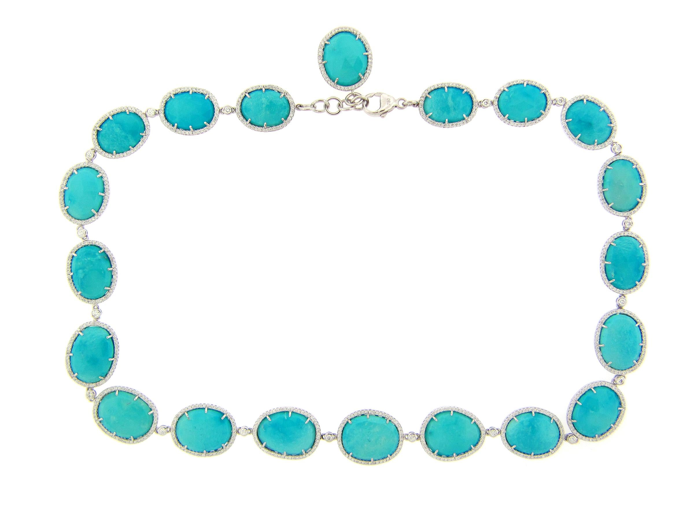 This stunning necklace features 20 Rose Cut Turquoise stones, each with their own Diamond Halo. This necklace is set in 18k White Gold. This necklace is secured by a large lobster chain and measures at 16.5