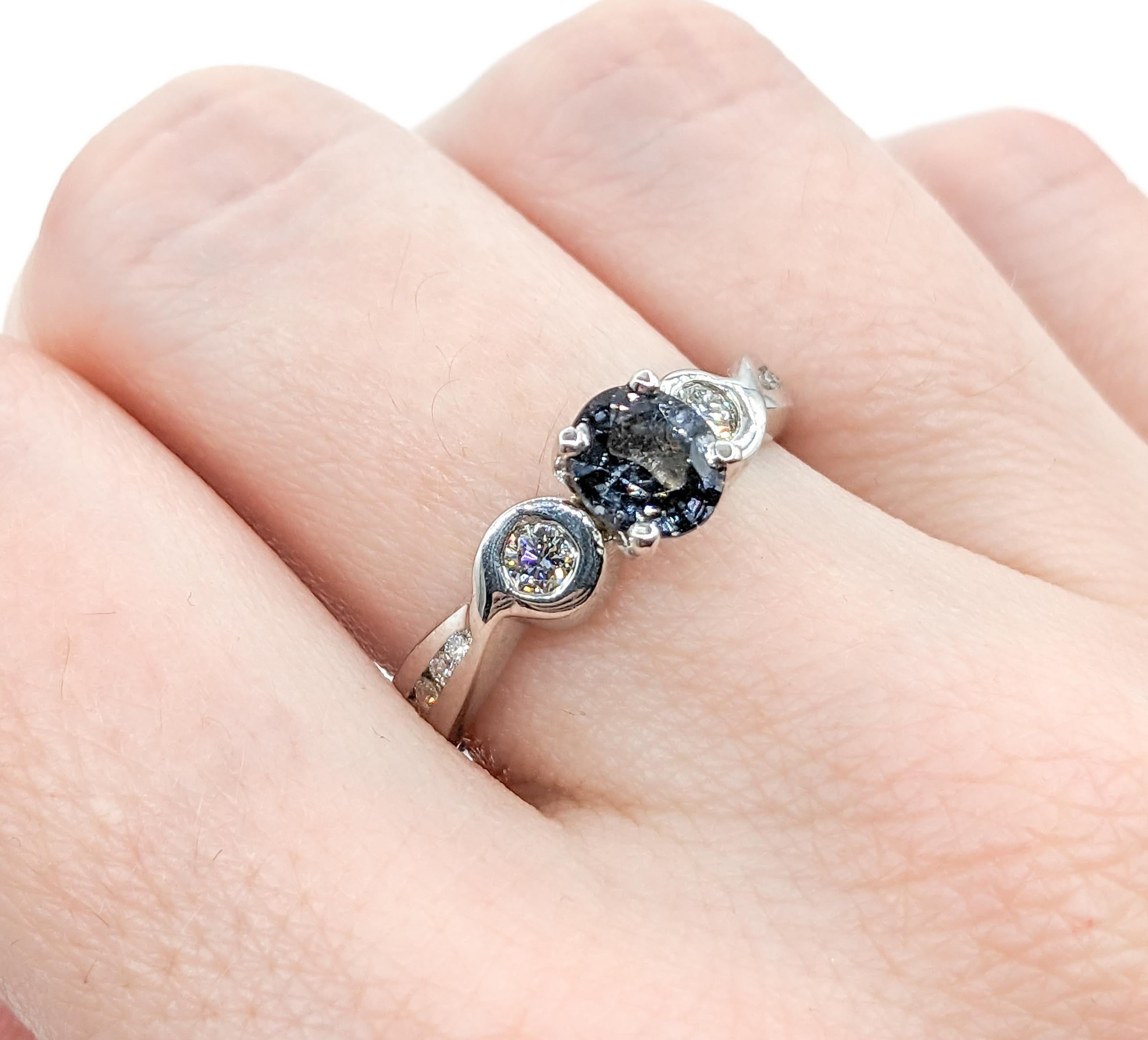.86ct Grey Spinel & Diamonds Ring In White Gold

Introducing our exquisite ring, masterfully crafted in 14kt white gold, showcasing a stunning combination of .33ctw of brilliant diamonds and a .86ct grey spinel. This ring celebrates a cool grey