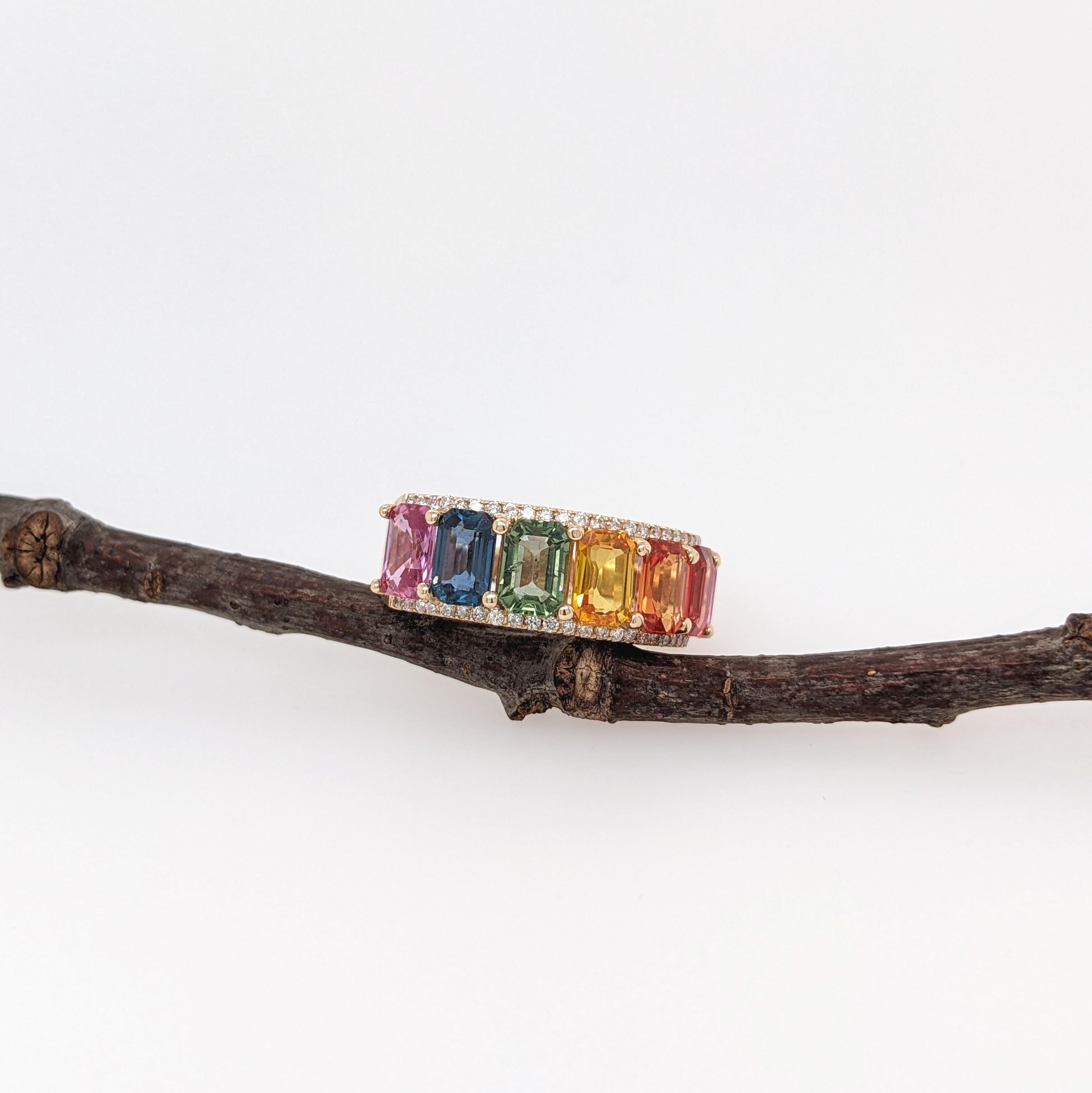 Don the colors of the rainbow with this gorgeous ring featuring 7 emerald cut sapphires in the colors of pink, blue, green, yellow, orange and red! Rows of earth mined natural diamonds bring an extra sparkle to this gorgeous statement piece, set in
