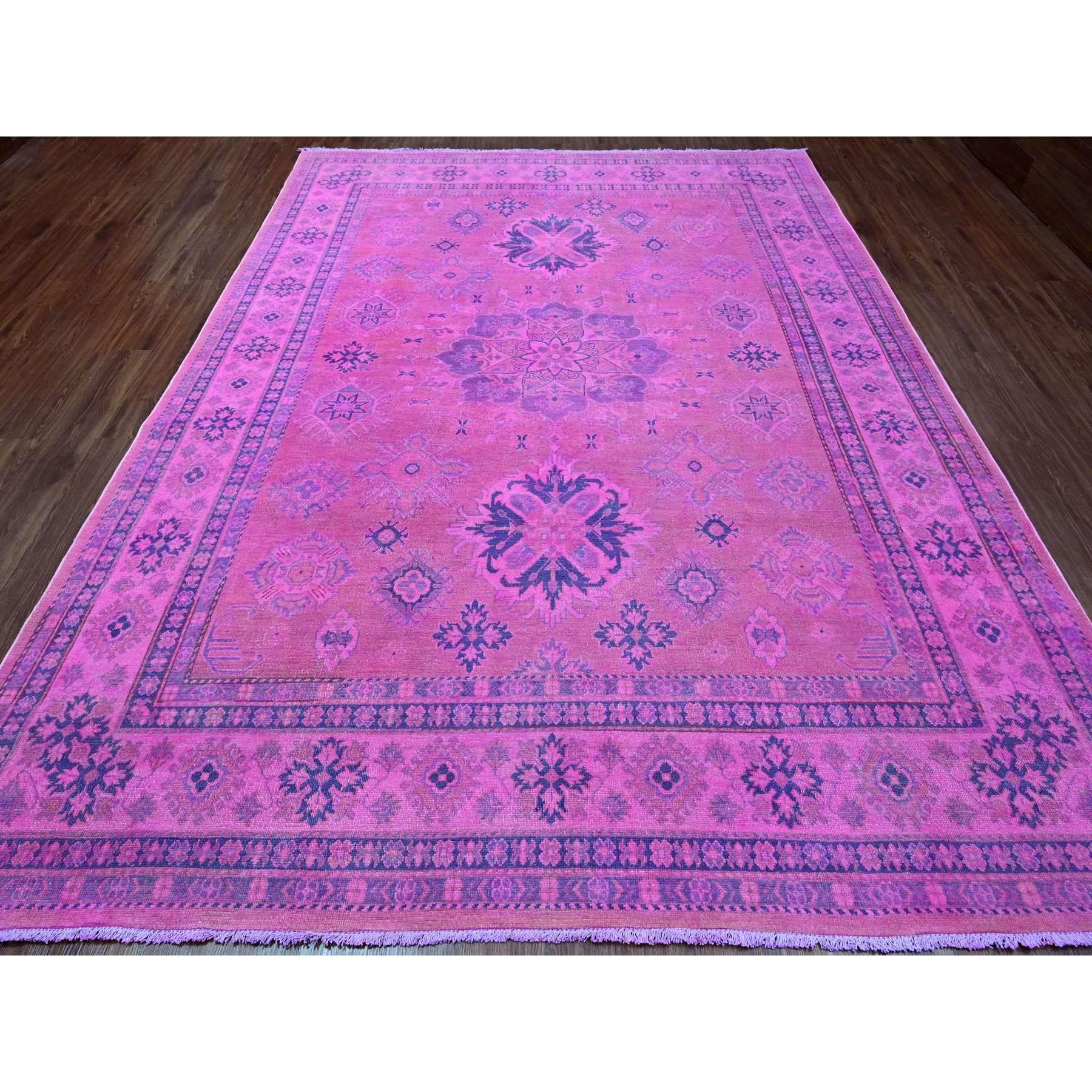 Taffy Pink, Overdyed Kazak with Tribal Medallion Design, Hand Knotted, 100% Wool, Oriental Rug
Primary materials: Wool
Latex: No Pile 
height: 0.25 Inches
Style: Traditional
Primary color: Pink
Secondary colors: None
Pattern: Oriental
