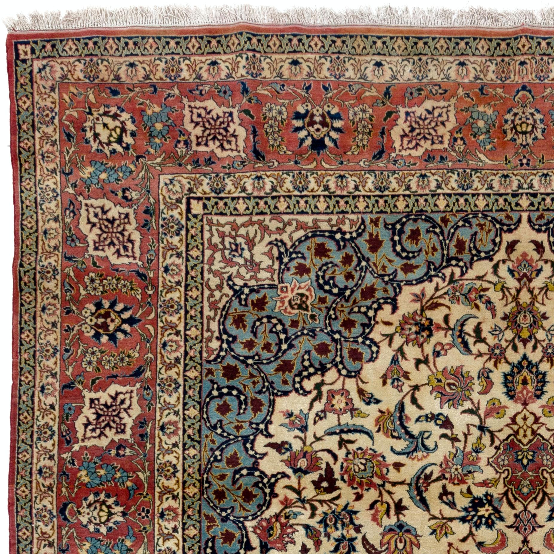 This elegant rug features an ivory field richly decorated with scrolling floral vines centered by a cusped brick red/brown medallion flanked at each end with large palmettes enclosed by sky blue spandrels with a large border of palmettes and