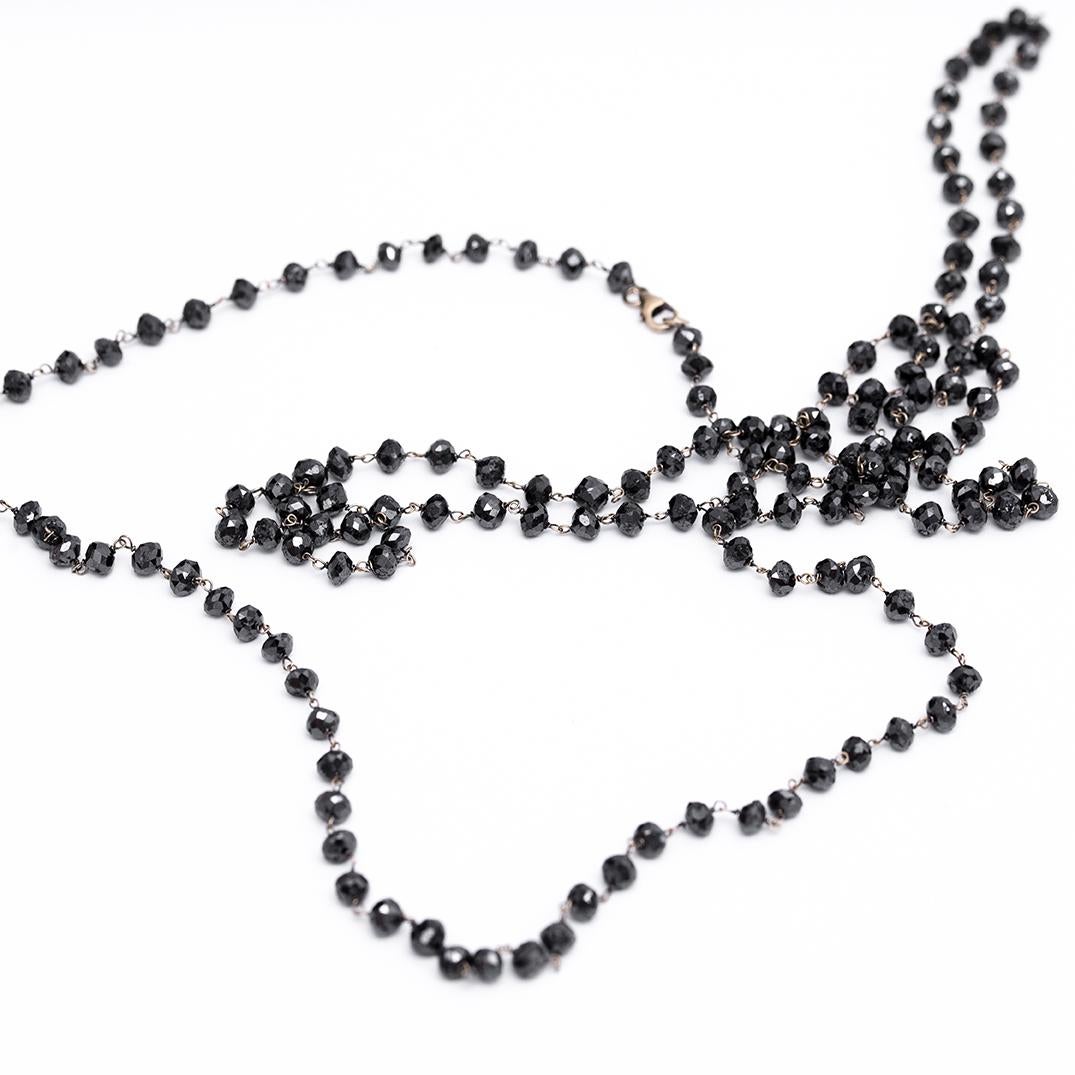 Black Natural Diamond Beads of 87 Carat Total Weight set in’18 Karat Gold Chain, 128 Centimeters Long.