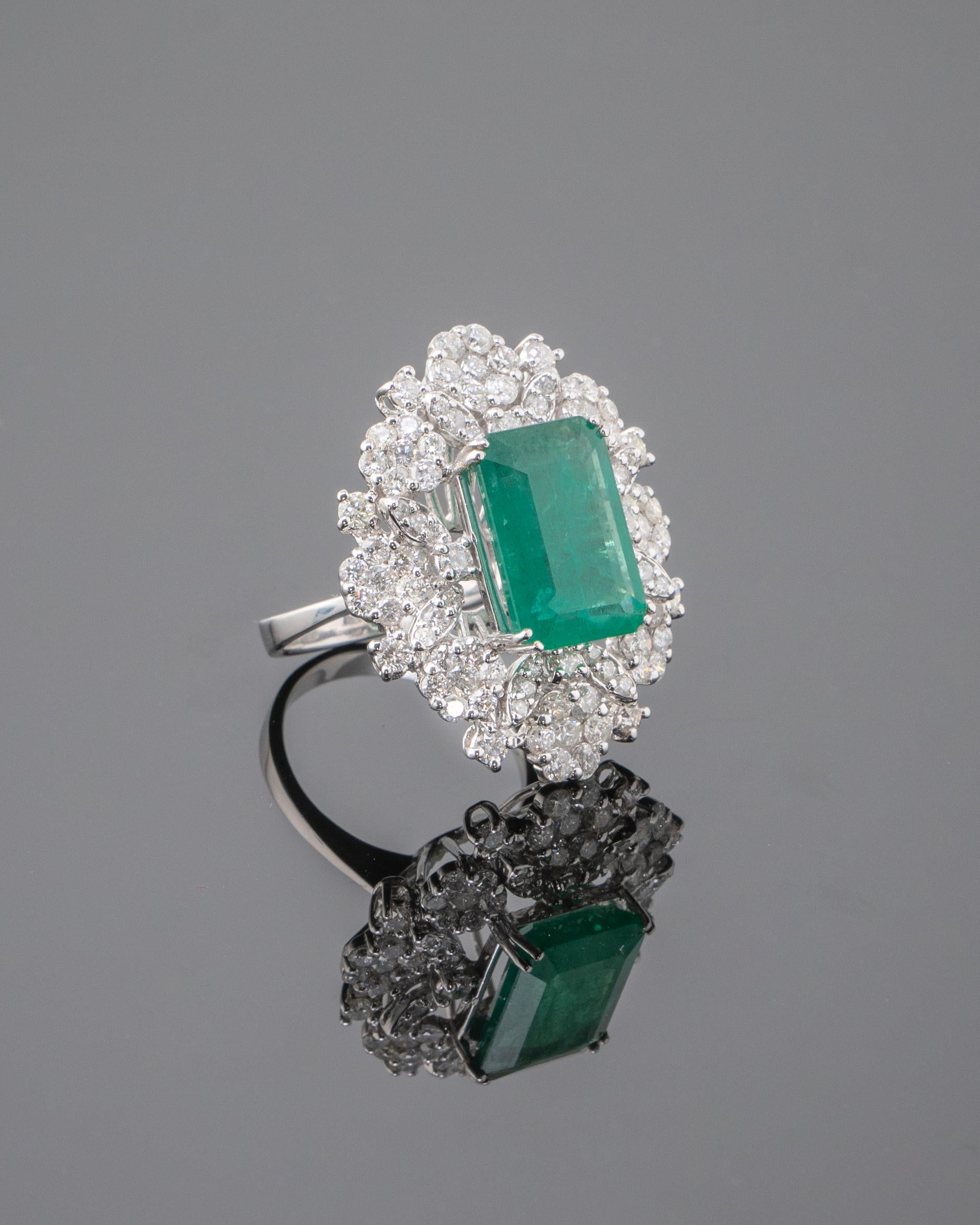 A beautiful 8.7 carat Zambian Emerald and 2.17 carat Diamond clutter - cocktail ring set in solid 18K White Gold. Ring is currently sized at US 6, can be resized.
Please feel free to message us if you have any queries. 
Free shipping provided.