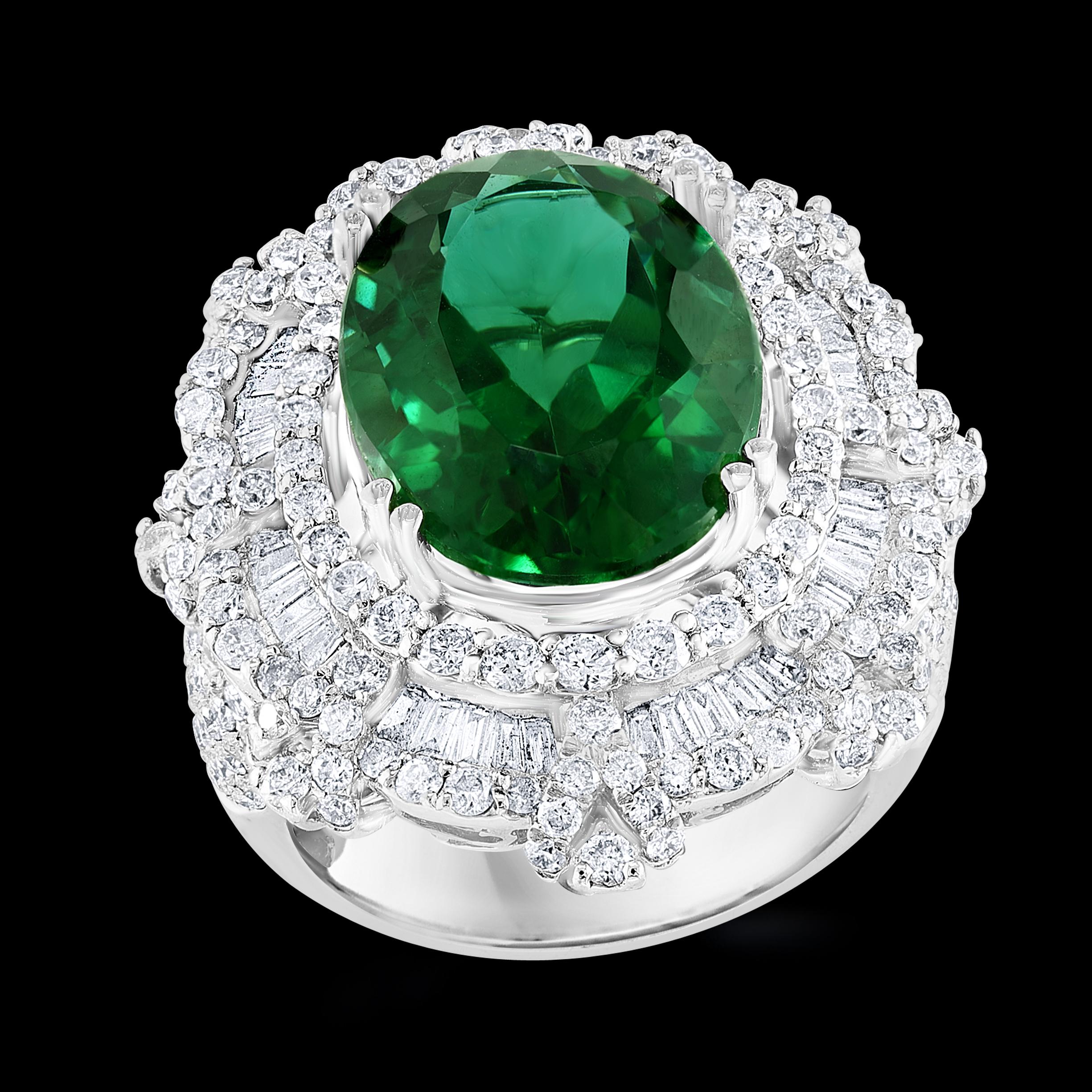  8.7 Carat Green Tourmaline & 4.2 Carat Diamond Cocktail Ring 18 Karat White Gold Estate
This spectacular Cocktail ring   consisting of a single Oval  Shape Green Tourmaline  8.7 Carat.  The  Green Tourmaline  is surrounded by approximately  4.2