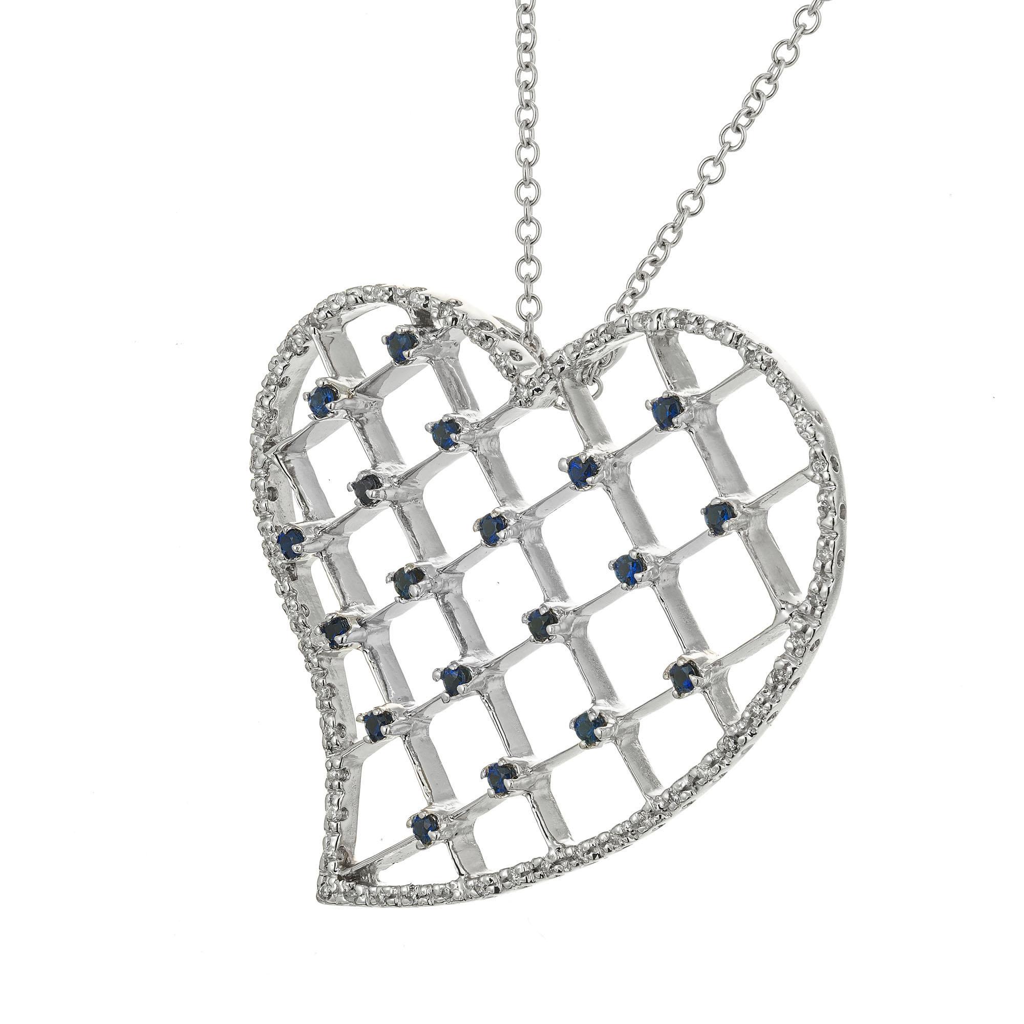 Sapphire and diamond heart pendant necklace. 19 round sapphires with a heart shaped 18k white gold halo of 48 round cut pave diamonds.  Signed by the designer VG. 18 inches in length. 

48 round diamonds approx. total weight .30cts, G, VS. 
19 round