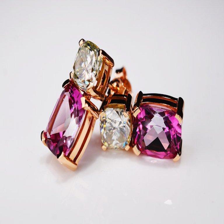 Contemporary style 18 karat rosé golden earrings, each featuring a 1.35 carat off white cushion cut moissanite and a 3.00 carat vivid pink modified cushion cut topaz. Total set features 2.70 carat moissanite and 6.00 carat topaz. One of a kind