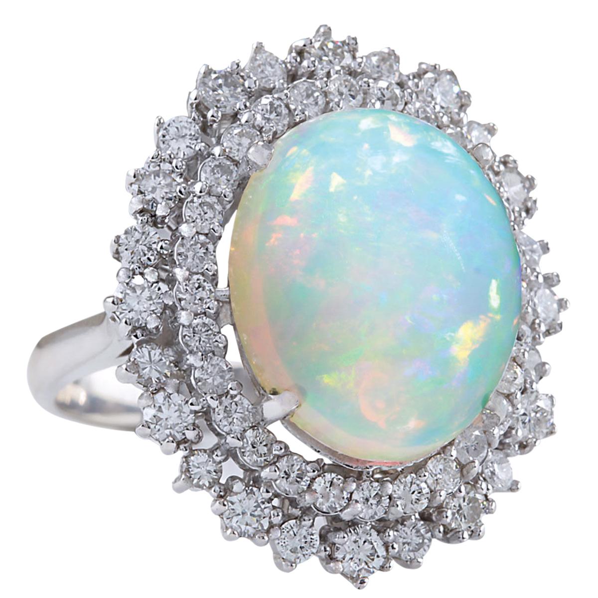 Stamped: 14K White Gold
Total Ring Weight: 8.5 Grams
Total Natural Opal Weight is 7.28 Carat (Measures: 16.00x12.00 mm)
Color: Multicolor
Total Natural Diamond Weight is 1.42 Carat
Color: F-G, Clarity: VS2-SI1
Face Measures: 24.65x21.10 mm
Sku: