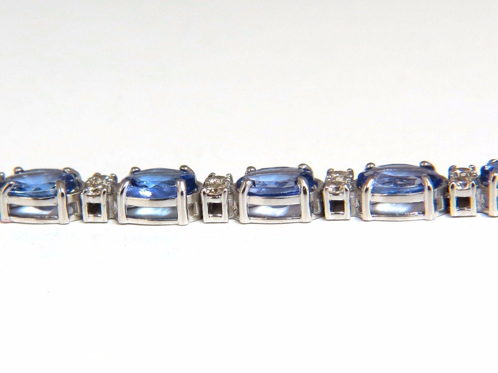 Classic Natural Tanzanite & Diamonds Tennis Bracelet  

Tanzanites: 7.90ct.

Average: 4.5 X 3.5mm each.

 Excellent & Vibrant colors.

Transparent & oval cuts.

Clean Clarity and very good cuts.

Bright Violet Blues



.80ct. diamonds:

Rounds &