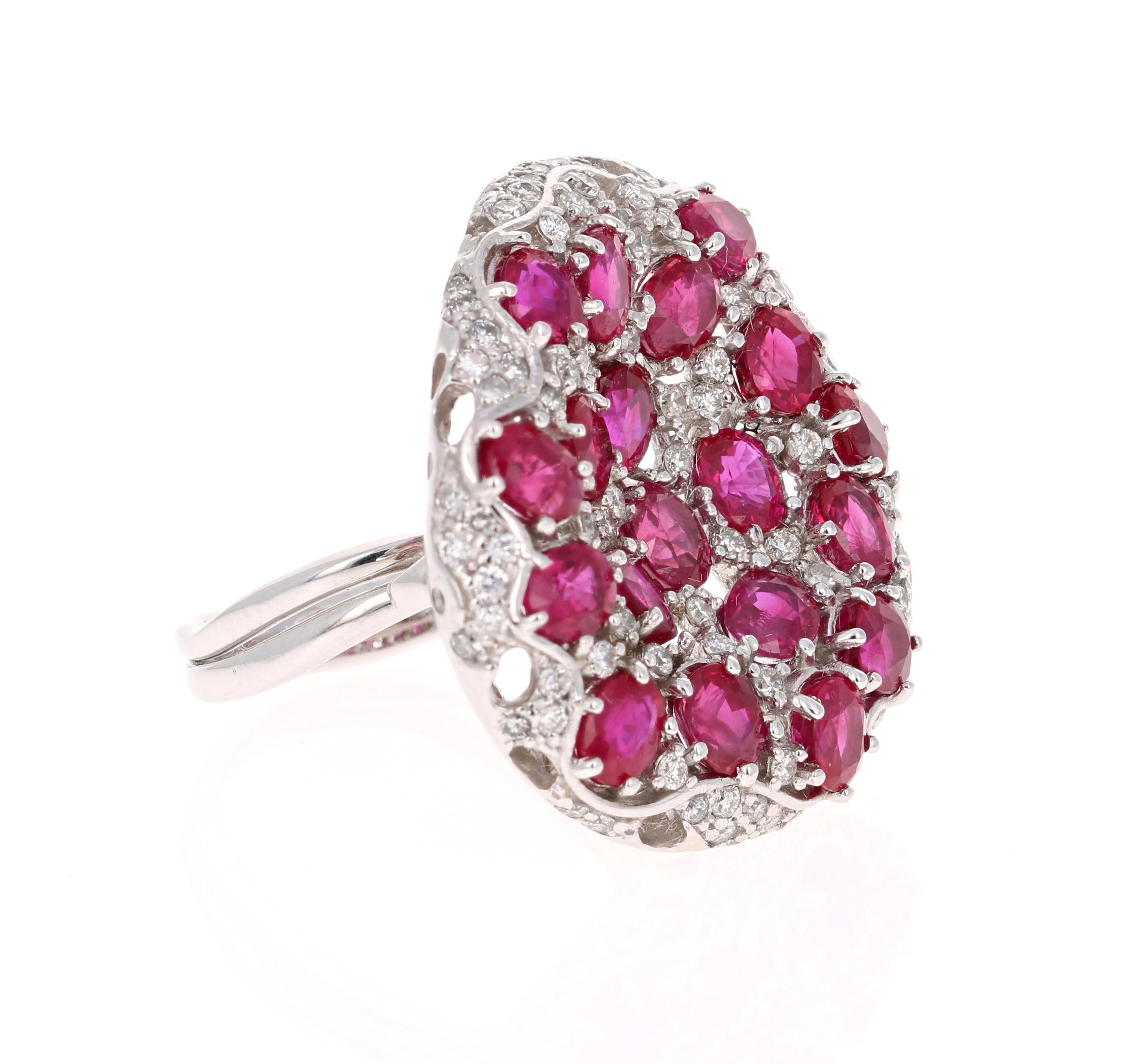 A Statement Ruby & Diamond Ring! 
This ring has multiple Oval Cut Natural Red Rubies weighing 7.77 Carats and 88 Round Cut Diamonds embellished around weighing 0.93 Carats. The clarity and color of the diamonds are SI-F. 

The ring is beautifully